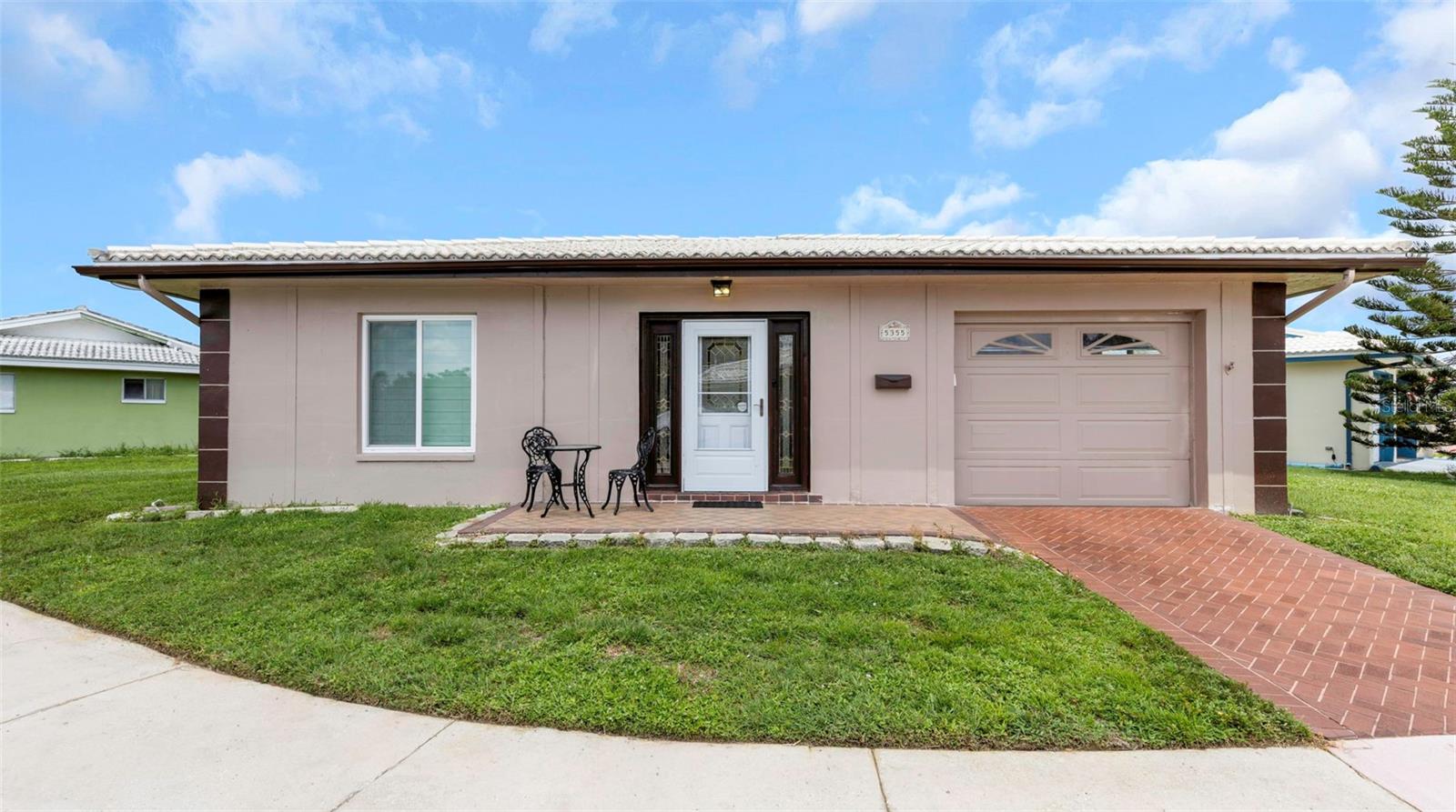 Welcome to this charming 1,440-square-foot single-family home in the desirable Springwood II 55+ community. Meticulously maintained and thoughtfully updated, this home offers comfortable Florida living in a peaceful setting.Facing southeast with the lake directly in front, the front porch is the perfect place to enjoy your morning coffee while watching the sunrise over the water.  Step inside to a welcoming entryway with closets on both sides for convenient storage. The spacious eat-in kitchen features a pantry and plenty of room for a breakfast table and chairs. Custom Roman shades in every room and impact windows throughout are additional highlights.  Major improvements include HVAC (2024), ductwork (2025), flat roof (2021), impact windows (2016), water heater (2015), electrical panel (2013), garage door opener (2023) and refrigerator (2016), with paperwork available. Consistent annual termite/pest control service and a Brinks security system.  Maintenance includes lawn care, water/sewer/trash, cable, homeowners and flood insurance on building - confirm with association. Springwood II amenities include a community room, fully equipped exercise room, library, swimming pool with bath and shower facilities, community laundry, and a peaceful screened room overlooking the lake.Come enjoy beautiful lake views, morning sunrises, and an inviting place to call home.  Located in the heart of Pinellas County with convenient access to shopping, restaurants, banking, beaches, airports and the interstate.