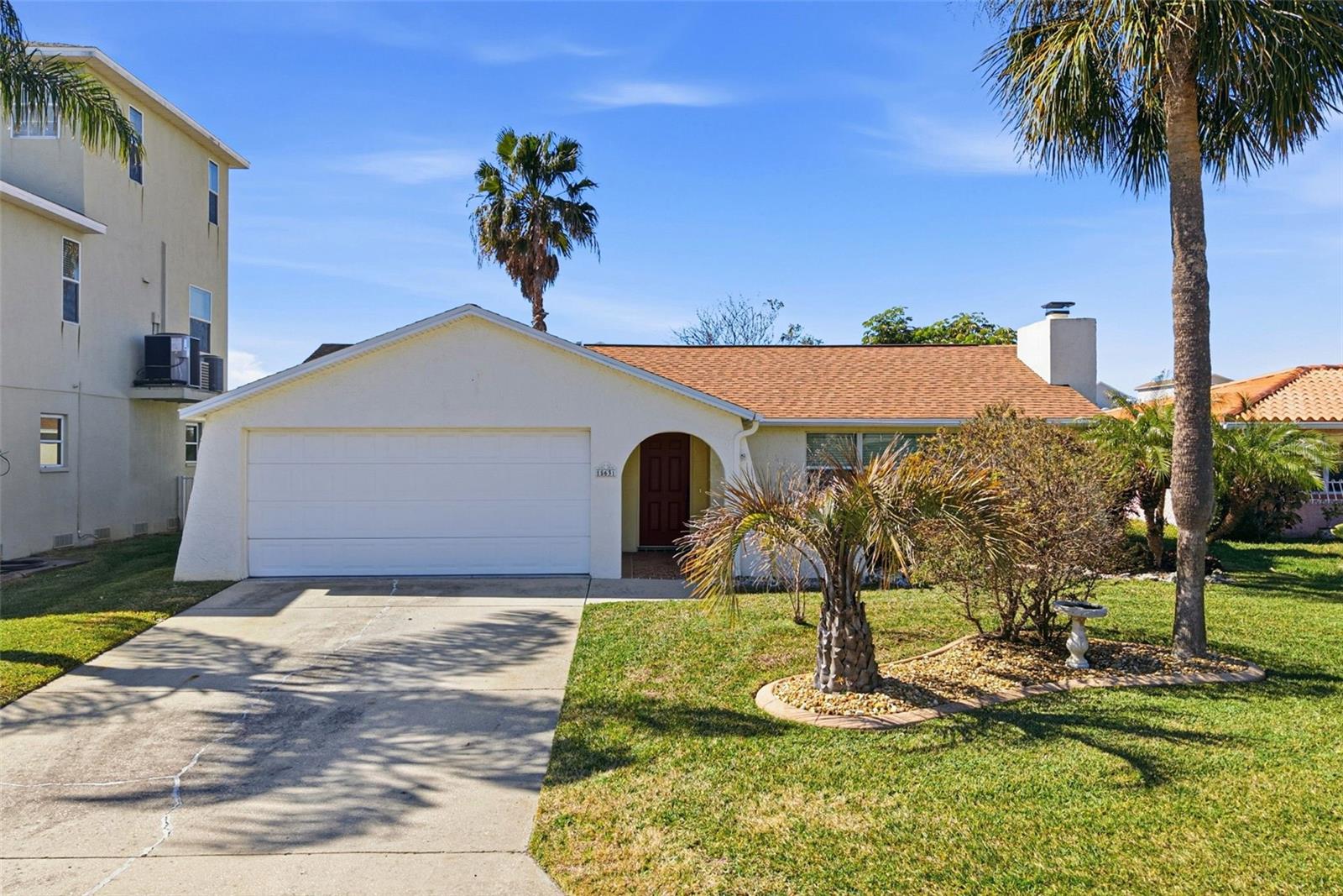 Welcome to Sea Pines - a hidden treasure boating community where your backyard meets the open water and everyday feels like a vacation. This beautifully remodeled 3-bedroom, 2-bath, 2-car garage home blends modern updates with relaxed coastal charm. Inside, you’ll find an open floor plan that has been fully renovated. The kitchen offers granite countertops and tiled backsplash, with new updated cabinetry and stainless-steel appliances.  The bathrooms are both modern & updated and the tiled floor throughout is beautiful. The primary bedroom offers a fully updated en-suite bath with private access to the backyard seawall & dock for future pool plans. This home offers just under 1400 heated square feet plus an additional enclosed 300 square feet of versatile living space—perfect for a sunroom, office, or bonus area to soak in the views.  Step outside and your backyard becomes your private waterfront retreat, complete with a gazebo for relaxing evenings, green space for gathering, a seawall, floating dock and boat lift (installed 2020). This home is surrounded by beautiful boat-lined canals and a community that embraces the boating lifestyle. With direct Gulf access you can be on the water in minutes for fishing, cruising, or sunset rides. Additional highlights include: 2-car garage that house the washer, dryer & hot water heater as well as a separate door to the exterior of the home.  The roof was replaced in 2023, the AC in 2025, this home offers a fireplace for cozy evenings.  This home is ideal for full-time living, seasonal escapes, or rental investment. Sea Pines offers an optional HOA of only $140/year, giving you access to a community boat ramp—totally optional, never mandatory. There are no mandatory CDD Fees and again HOA is optional. Just a few minutes to Sunwest Park’s beach and paddle sports, plus shopping, dining, hospitals, and only about 45 minutes to Tampa International Airport. Ideally located within an hour of Florida's most popular beaches, including Clearwater, St. Pete beach & Honeymoon Island. The location is the perfect balance of convenience & tranquility-Close to Everything yet tucked away from the hustle and bustle!Affordable. Updated. Waterfront. This is Florida living done right. Don't delay call today!