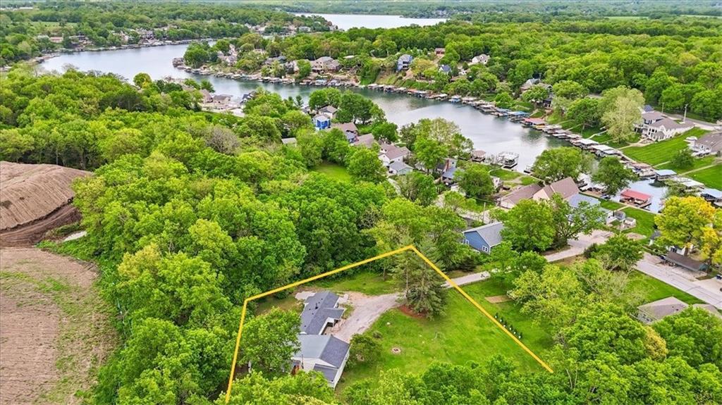Fully renovated, this private 3bd/3ba lakeside ranch home, sits on a 0.69 acre lot with a private dock for swimming, boating or fishing fun.  Designed for seasonal, weekend or rental usage, this house stands ready with new siding & doors, some new windows, wiring & panel box, new HAVC / AC, new wood plank flooring, with tiled bathrooms & showers.  New kitchen cabinetry, with appliances and separate coffee bar.  Primary bath offers a double head glass shower and vanity with an outdoor shower for pets or upon returning from a day on the lake.  You'll enjoy the summer evenings and star lite nights and family memories around the outdoor campfires.  Restaurants and shopping are 5 minutes away.  Come, unwind and enjoy relaxing at the lake!
