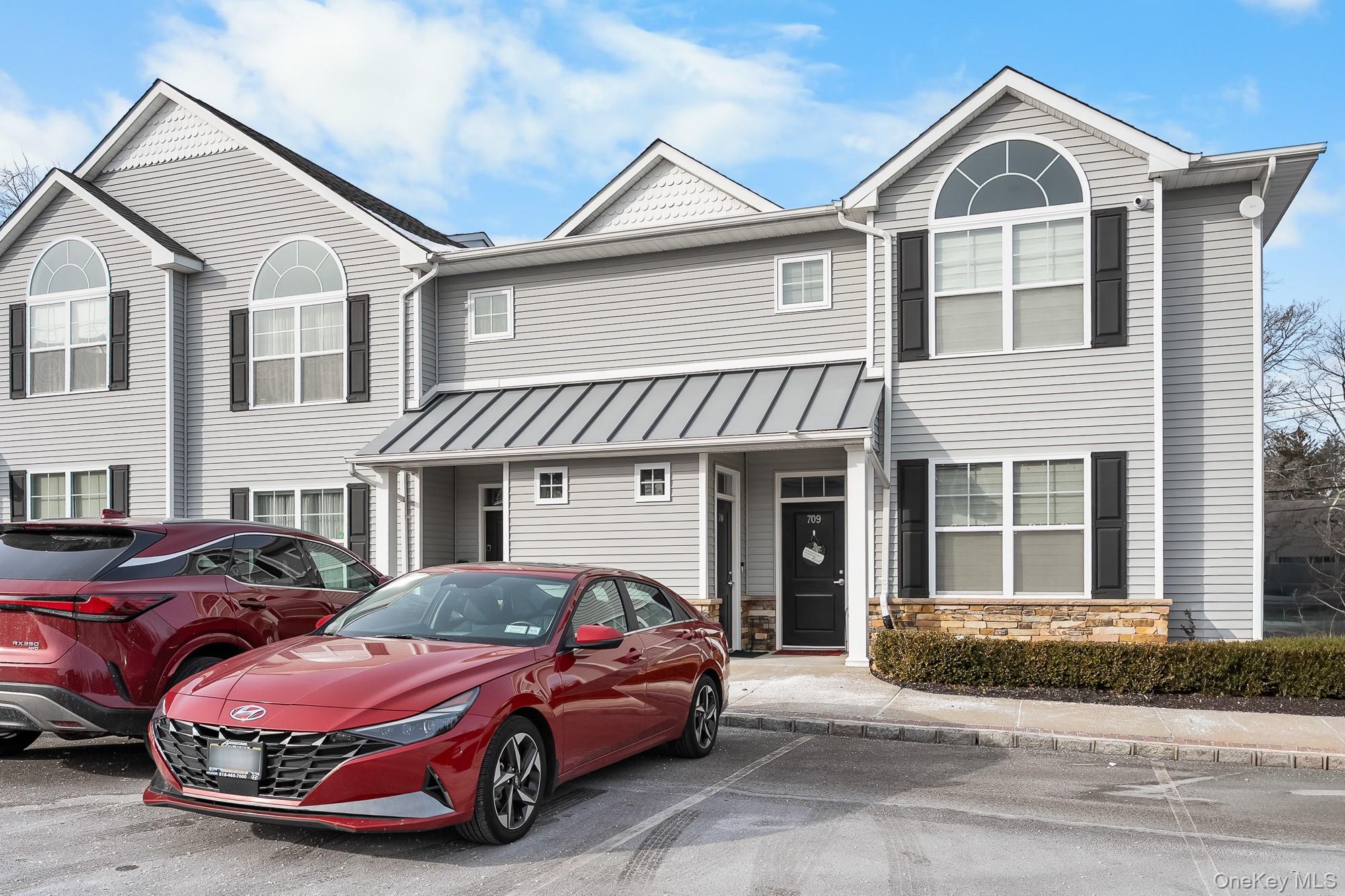 Enjoy life in the vibrant Breton Hills 55+ Community in Glen Cove. This desirable ground-floor end unit offers easy, single-level living with an open-concept layout ideal for both everyday comfort and entertaining. The spacious living room flows seamlessly into the dining area and modern kitchen, which features ample cabinetry, generous counter space, and stainless-style appliances.The home includes two large bedrooms, each with closets, and two beautifully updated bathrooms. Additional highlights include abundant storage throughout and a washer and dryer conveniently located inside the unit.Breton Hills offers an active and welcoming lifestyle with beautifully maintained grounds and a resident clubhouse featuring an interior fireplace, kitchen, and fitness area. Outdoors, residents enjoy a patio with gas barbecues, perfect for gatherings and seasonal events. The community hosts social activities such as card games and dinners, fostering a friendly and engaging atmosphere. Ample parking and designated garbage areas for residents add to everyday convenience.This move-in-ready condo is located within a secure, gated community and offers close proximity to all that Glen Cove and the North Shore have to offer. Enjoy nearby Morgan Park, Pryibil Beach, Crescent Beach, Glen Cove Golf Course, and miles of scenic waterfront. Conveniently located near shopping, dining, and major highways, this home presents an exceptional opportunity for comfortable, low-maintenance living in a sought-after 55+ community.