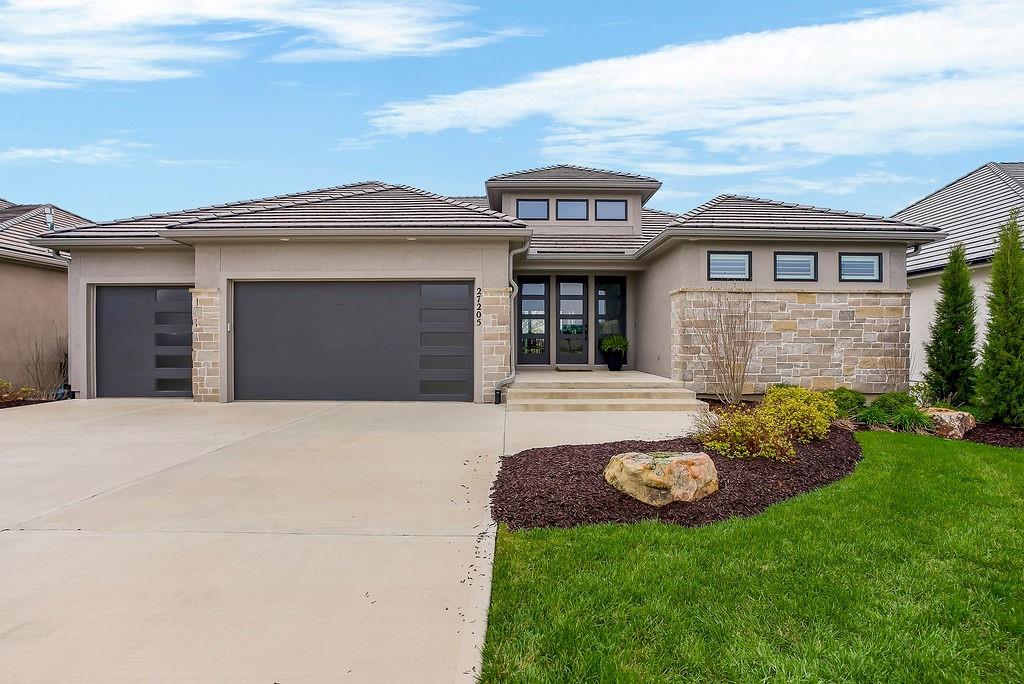 Like New and perfectly positioned on a premium lot backing to the award-winning Shadow Glen Golf Course, this stunning reverse 1.5-story home offers the ideal blend of luxury, comfort, and thoughtful design. With 5 bedrooms and 4 full baths, this home is crafted with beautiful details throughout. The main level features a spacious primary suite with a spa-like feel, complete with a walk-in closet that conveniently connects to the laundry room. Two additional bedrooms are located on the main level, including one with its own private bath—perfect for guests or a home office. The heart of the home showcases a large quartz-topped island, expansive pantry, and open living spaces designed for both everyday living and entertaining.The walkout lower level is an entertainer’s dream, featuring a full bar area, generous recreation room, plus two additional bedrooms and a full bath. You’ll also find two separate storage areas, including a storm shelter for added peace of mind. Step outside to take in sweeping golf course views overlooking Hole #5, creating a serene and picturesque backdrop. Whether hosting gatherings or enjoying a quiet evening at home, this property offers the perfect setting. Welcome home.