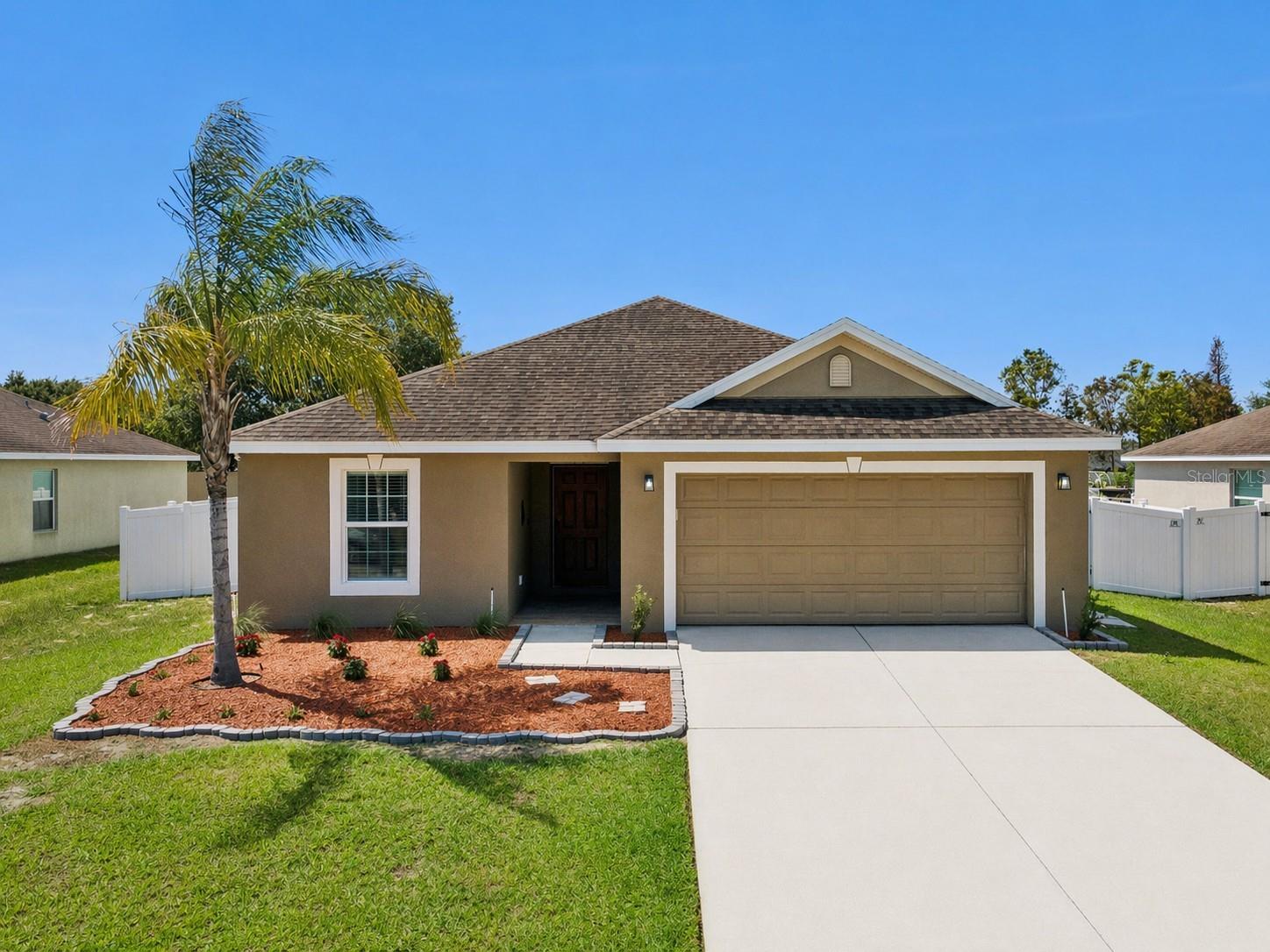 Don’t miss out on this amazing opportunity! Located in the community of Lake Alfred Estates just outside Lake Alfred, this 3 bed/2 bath home is nicely upgraded and move-in-ready. Kick your shoes off in the foyer and enter into an open floorplan living area. Spend time with family in the spacious living room with ample room for entertaining. The gorgeous kitchen has plenty of granite counter space, custom cabinets, and nice modern light fixtures including beautiful appliances. Eat your meals at the breakfast bar or in the cozy dining room adjacent to the kitchen. The generous master bedroom overlooks the backyard! The attached en suite includes a tub, shower, combo and a cavernous walk-in closet. Two more spacious bedrooms and the second bathroom, perfect for little ones or guests are accessed directly from the foyer, as is the convenient interior utility room that comes with two full-sized machines, a washer and dryer. Outback you can relax in comfort under the covered patio and look out to the large backyard with plenty of room to run around and play or even for a pool. Located in between Disney and Legoland and only 7 minutes from the I-4, this home has it all!