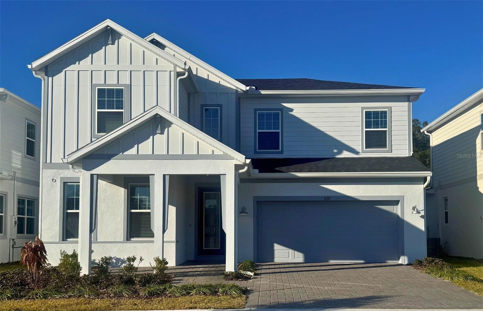 Under Construction. Introducing The Estates at Nona Sound, a collection of luxury single-family and estate-style homes in an ideal location just minutes from the acclaimed Lake Nona Town Center. Enjoy a private, gated new neighborhood featuring a tot lot, pickleball courts, and an open-air pavilion.The beautifully designed two-story, 4-bedroom, 3-bathroom, 2 car garage Coral Grand home offers the perfect blend of luxury, comfort, and functionality. This homesite is conveniently located at the front of the community, right next to the main entrance. The beautiful exterior appearance of the home is our Farmhouse style with a front porch and a covered lanai in the back with a privacy wall in your backyard. As you step inside, you are greeted by a grand foyer that opens to the second floor, creating an inviting and open atmosphere. To your left, two spacious secondary bedrooms and a full bath provide ideal accommodation for guests. Travel deeper into the heart of the home, and you’ll find an expansive open concept layout that seamlessly connects the gathering room, kitchen, and cafe. Large windows throughout the main living areas flood the space with natural light, creating a warm and welcoming ambiance. The chef’s dream kitchen is a showstopper, complete with Built-In stainless steel Whirlpool appliances, and soft-close Winstead White cabinetry. The Statuario Silestone countertops, decorative tile backsplash, and pendant prewiring elevate the space, making it perfect for both cooking and entertaining. Step outside to enjoy the extended covered lanai, complete with zero corner sliding glass doors that create a seamless transition between indoor and outdoor living. Perfect for entertaining or relaxing, this space is finished with stylish pavers for added charm. The owner's suite, located conveniently on the first floor, provides a private retreat with ample space, and is complemented by a luxurious en-suite bathroom with a walk-in shower with rain shower head, private water closet, and linen closet. The laundry room, also thoughtfully located on the first floor, includes a Washer and Dryer adding to the home’s convenience and ease of living. Upstairs, you’ll find two additional bedrooms, a full bathroom, and a spacious loft, offering plenty of room for everyone. Every detail of this home has been carefully curated, from the Shaw wood-look luxury vinyl plank flooring throughout the first floor to the Aliance White Sand tile in the bathrooms and laundry to the plush, stain-resistant Shaw carpeting in the upstairs loft and bedrooms. Designer-curated finishes elevate every corner of this home, including Bronze Gold hardware and plumbing fixtures, 2” faux wood blinds. For those who appreciate modern technology, this home comes equipped with a smart thermostat, video doorbell, LED downlights, and digital IP camera pre-wire, ensuring your home is as connected as it is beautiful. Experience the luxury of modern living with timeless design – schedule a tour today and see all that this exceptional home has to offer!