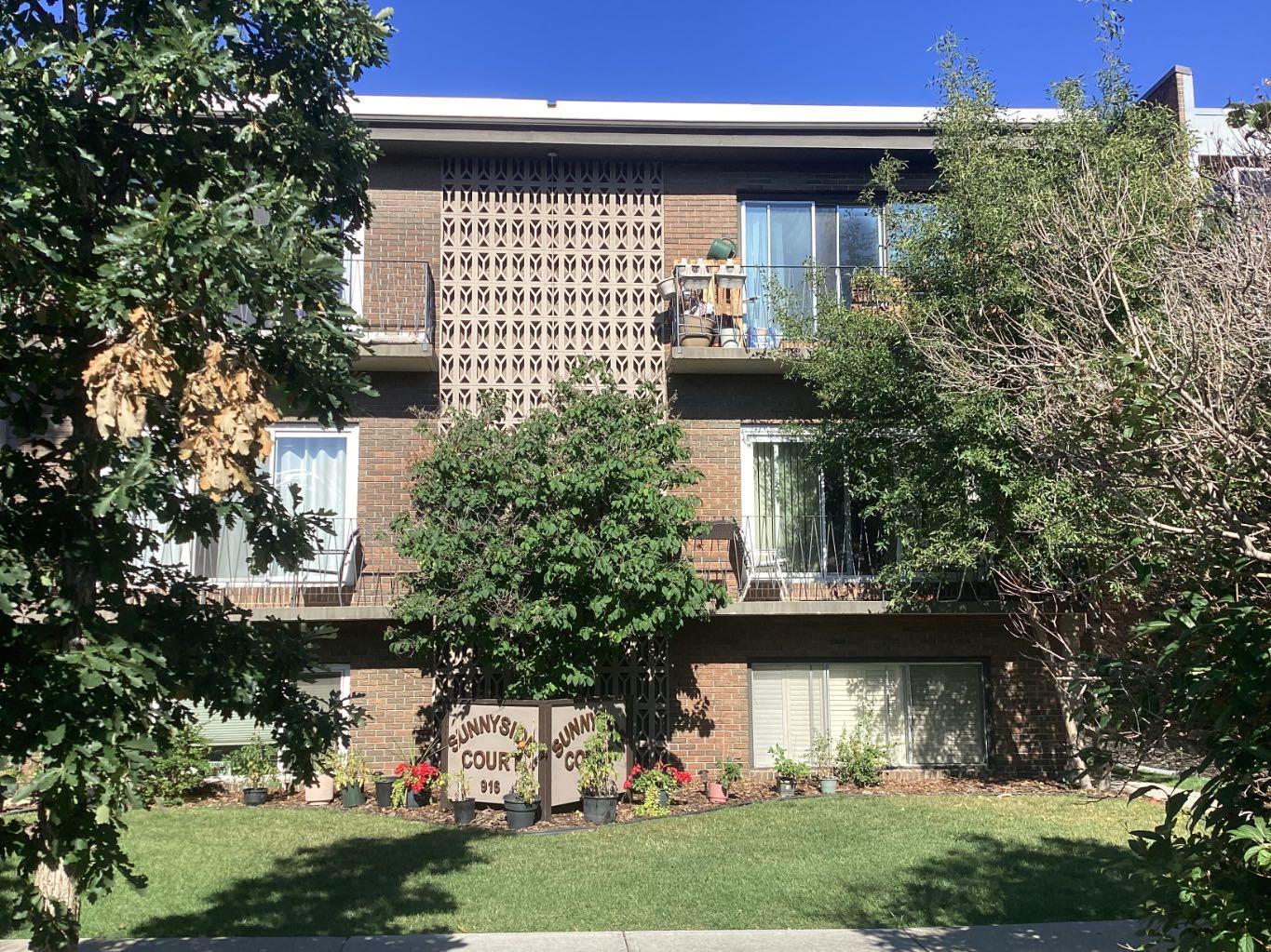 Location! Location! Welcome to charming Sunnyside, one of Calgary’s oldest and most desirable communities, where tree-lined streets, character and an unbeatable location come together. Tucked into a small complex this bright and charming one-bedroom condo, with views of the street, offers an inviting place to call home. You will be impressed! The living room is filled with natural light from the large patio door. It extends your living space to the private balcony that offers a quiet, relaxing atmosphere — the perfect place to enjoy your morning coffee, unwind at the end of the day, and watch the birds, squirrels and neighbourhood activity.  The functional kitchen is conveniently positioned just off the living room, with a dining area that keeps the layout open and comfortable. The spacious bedroom features a large wardrobe closet, providing excellent storage space.  Easy-care laminate flooring adds a practical touch throughout. An assigned parking stall is included, but with so much right outside your door, you may find you rarely need the car! Whether you’re a first-time buyer, investor or simply looking for an affordable way to enjoy Calgary’s vibrant inner city, this Sunnyside gem delivers charm, convenience and an exceptional lifestyle in a fantastic location. Just steps from Kensington’s trendy shops, restaurants, cafés and boutiques.  Walk to the C-Train station, downtown, river pathways and so many of Calgary’s favorite neighbourhood spots.  A great place to call home! A pleasure to show!