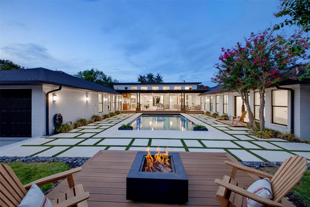 Introducing a RARE STUNNING GEM with multi-generational living in mind. This U-shaped, SINGLE STORY residence sprawls across5,003 sq ft, offering an unmatched lifestyle. Revel in 4 bedrooms (all with ensuites), 5.5 bathrooms, a media center,and a spacious study. Two flex rooms...your choice of what to do with them. Gourmet chef's kitchen complemented bya fully equipped butler kitchen - 2 of everything ... an entertainer’s dream! A laundry center, complete with a dog washstation. The east wing is a private sanctuary including your own spa like bathroom.  Outdoors, an oversized poolbeckons you to unwind. Delight in 600+ sf of covered alfresco space, glass railings, and an outdoor kitchen - aharmonious fusion of indoor and outdoor living. Witness contemporary luxury and organic tranquility seamlesslyintertwined in this masterpiece. All this, on one story - a must-see to EXPERIENCE the level of luxury living. Home flooring is primarily beautiful hardwoods and tile, with carpet in the media room solely. Conveniently located near some of Dallas best private schools, dining and shopping!