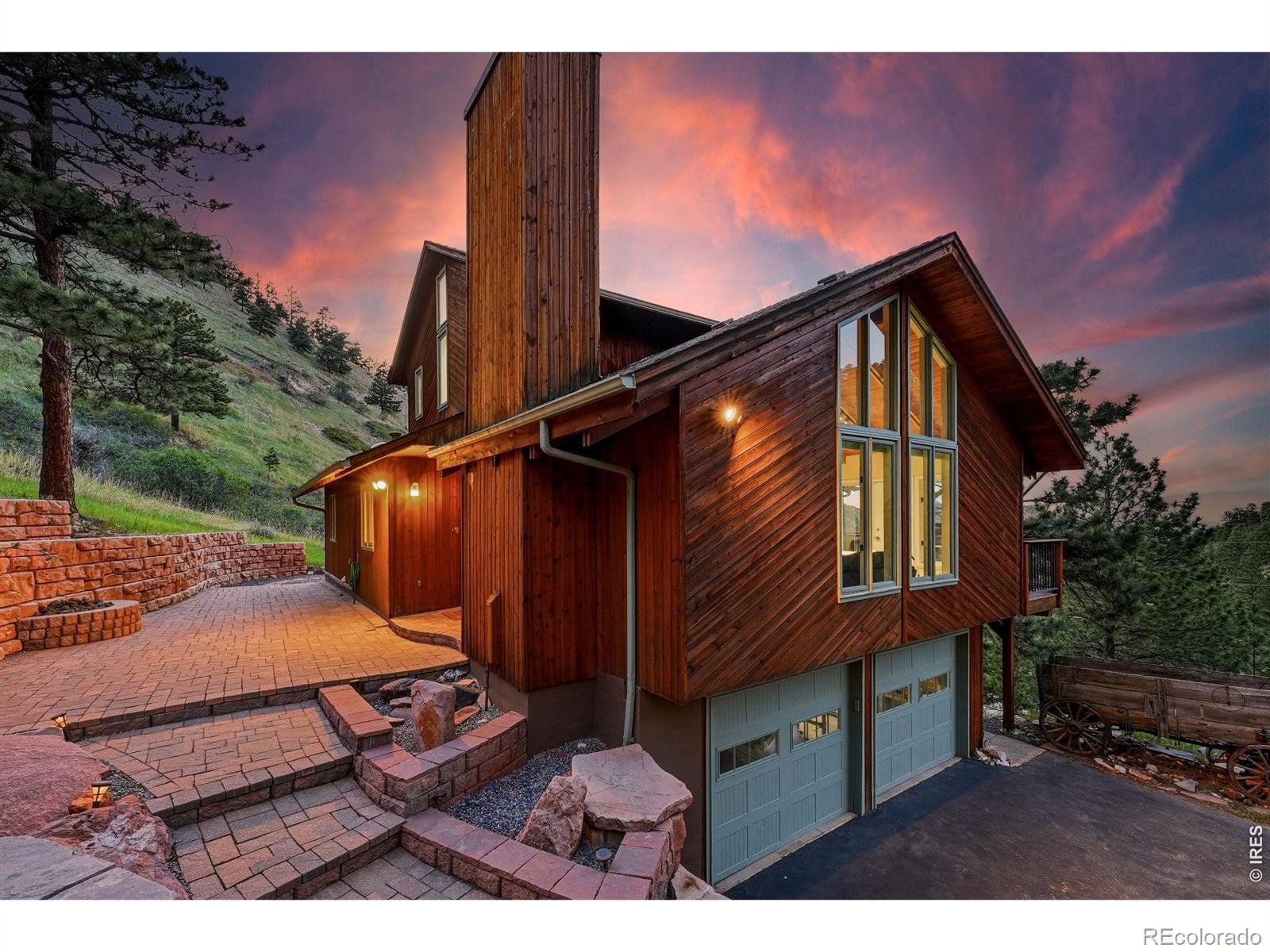 Easy mountain living with gorgeous valley views, magical sunrises, surrounded by wildlife and community in sought-after lower Pine Brook Hills, only 5 minutes to Broadway. This gently lived-in home offers 3 bedrooms + office and 3 bathrooms with an oversized garage. Classic mountain design with slatted wood ceilings, two living rooms with fireplaces, an expansive 1377sf two-level composite deck, a separate lower-level entry, custom-designed xeriscapes with a fire pit, and a new Class IV roof (6/26). Trail access in three directions, and Mt. Sanitas and Wonderland Lake trails are a roll down the hill. Hawks and paragliders drift overhead, providing a rainbow of color. Visit cafes, restaurants, and groceries on Broadway, or venture 10 minutes to Pearl Street. Central gas, a private reservoir water supply, insurance advantages with fire hydrants and Wildfire Partners certification. Flat and paved driveway, and county-maintained roads in winter. Tucked along a quiet non-through street, the gently lived-in home at 607 N Cedar Brook truly offers the balance of peaceful retreat and everyday convenience. Welcome to your piece of the Boulder mountains. Please check out the video!