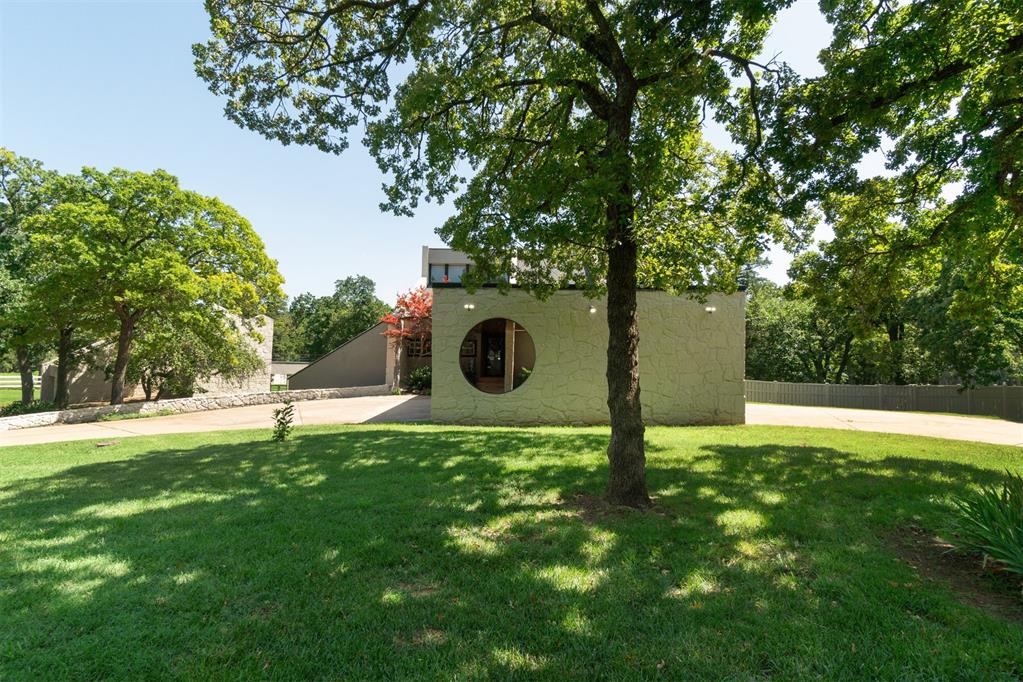 Come take a look at the contemporary home that sits on 2.28 acres on Deer Creek schools.  At the end of a cul-de-sac makes for very few cars and extra quite living.  Home offers four bedrooms and three full bathrooms and one half bathroom.  It is split floor plan with the main level having wet bar, living room, half bathroom and office space.  Main level also has great view of the acreage and access to the incredible back deck.   Downstairs has the kitchen, living room, dining room, three full bedrooms and two bathrooms.   The fourth bedroom and third full bathroom is over the detached two car garage.  The acreage has so much potential with a horse barn, huge yard, tons of driveway space with porte-cochère.  Great home for entertaining inside and outside.  Roof replace in 2019. Septic system redone in 2017. Heat and air units both less than 5 years old.