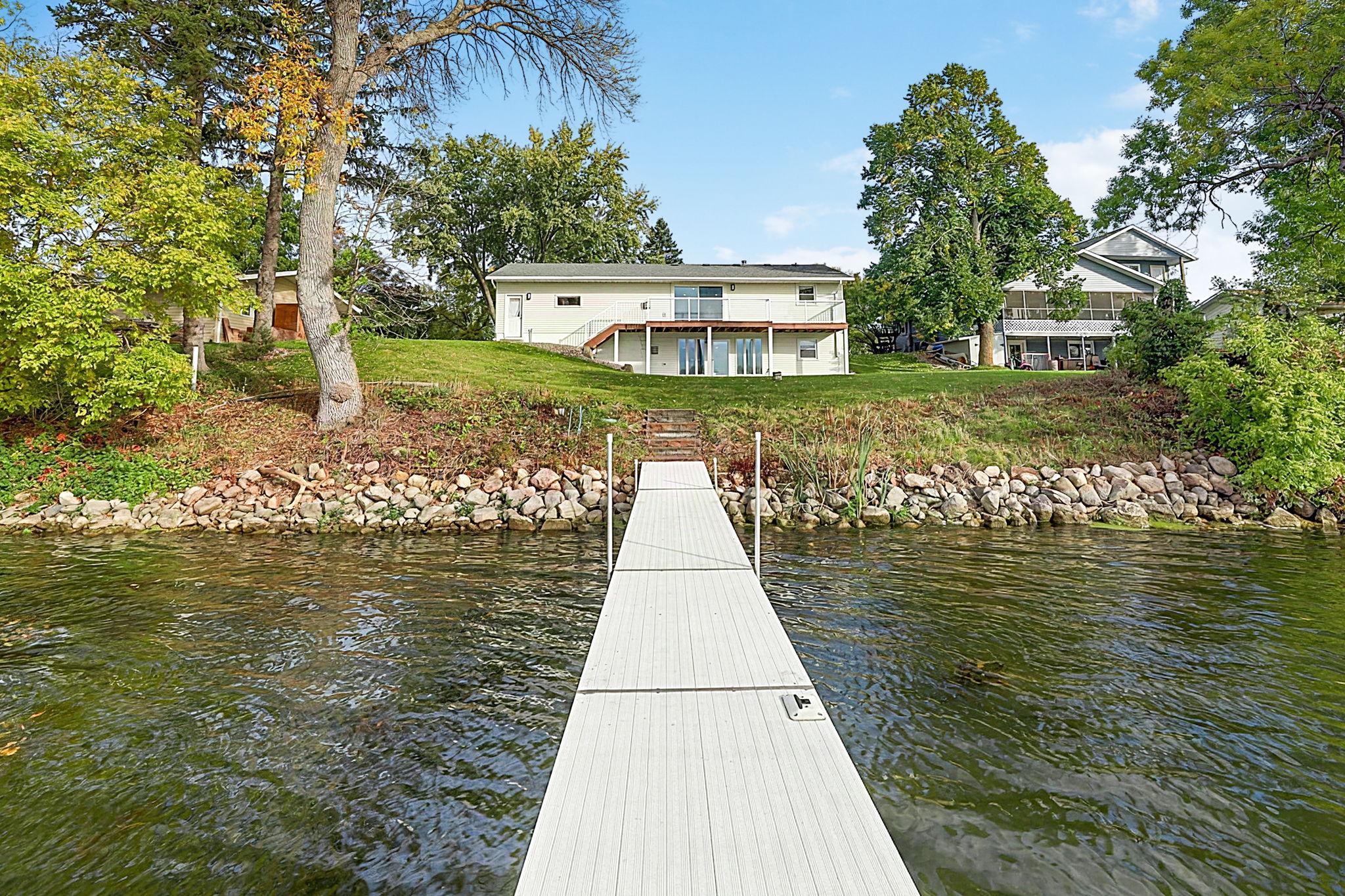 Lake home with golf at your doorstep. Small-town living with big-city convenience. This 3-bedroom, 2-bath walkout rambler offers an incredible location on the Sauk River Chain of Lakes in the Rich Spring Golf Course neighborhood. The main level features two bedrooms a bathroom and an updated kitchen with granite countertops, stainless steel appliances, and custom cabinetry along with stunning, unobstructed lake views from the living room that create a private, secluded feel.The lower level adds a third bedroom and bath, spacious family room and wet bar—perfect for entertaining after a day on the lake or golf course. An oversized 2-stall attached garage offers plenty of storage, plus a dedicated golf cart garage door for easy access to the course.Tucked away on a quiet cul-de-sac, yet just minutes from groceries, restaurants, breweries, schools, and more. Approximately 20 minutes to St. Cloud and 1 hour to the Metro, this is an exceptional opportunity for a lake home, full-time residence or a slower pace of life without sacrificing convenience.