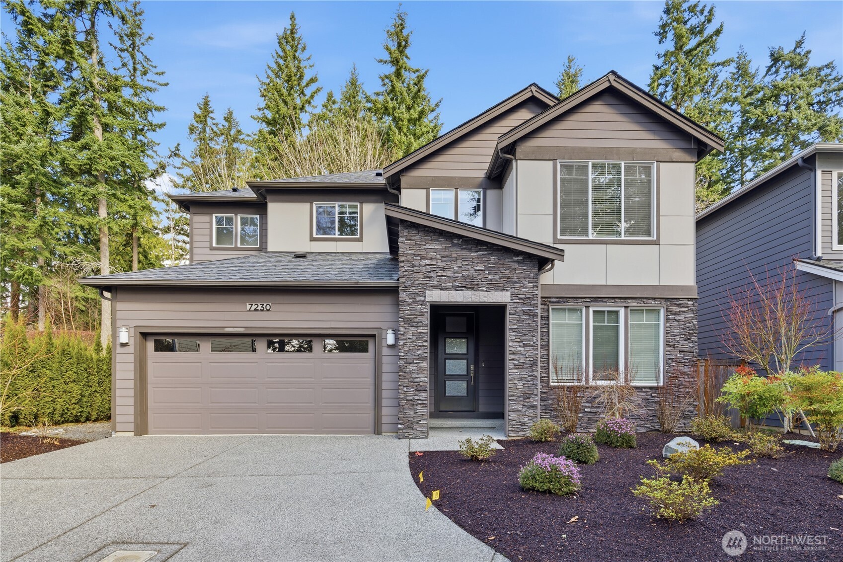Experience modern elegance in this stunning south-facing DR Horton home, built in 2021 and ideally situated in Kirkland’s tranquil Juanita neighborhood. Set on a nearly 1/4-acre lot, this 4-bedroom, 2.5-bath residence showcases an open and airy design with soaring 9-ft ceilings on both levels. A generous main-floor office offers flexibility for guests or a potential 5th bedroom. Refined finishes include hardwood floors, quartz countertops, stainless steel appliances, and a spa-inspired primary suite with a soaking tub. Enjoy premium comforts such as A/C, a tankless water heater, and a private low-maintenance backyard designed for effortless living. Quiet street, no HOA, and close to parks and scenic trails.