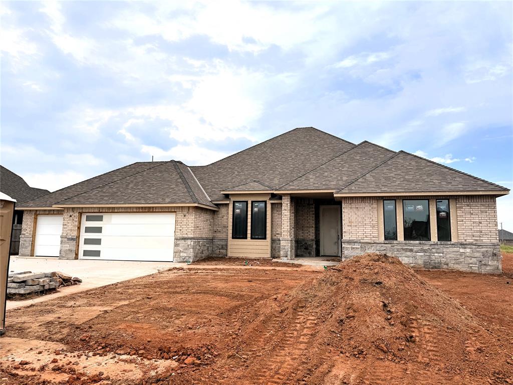 This stunning home features 4 large bedrooms w/ walk-in closets, 3 full baths & 3-car garage. The open kitchen boasts a 9.5' kitchen island w/ pendant lighting above, built-in appliances, custom vent hood and walk-in pantry. Large living and dining windows bring tons of natural light to the space. Contemporary finishes selected by Studio Tatum include stained oak, slab-style cabinets, matte black accents, and incredible tile & countertop selections throughout. Alarm system w/ unlimited smart-home capabilities, Full sprinkler, 1 year builder warranty + 10 year structural warranty by QBW.