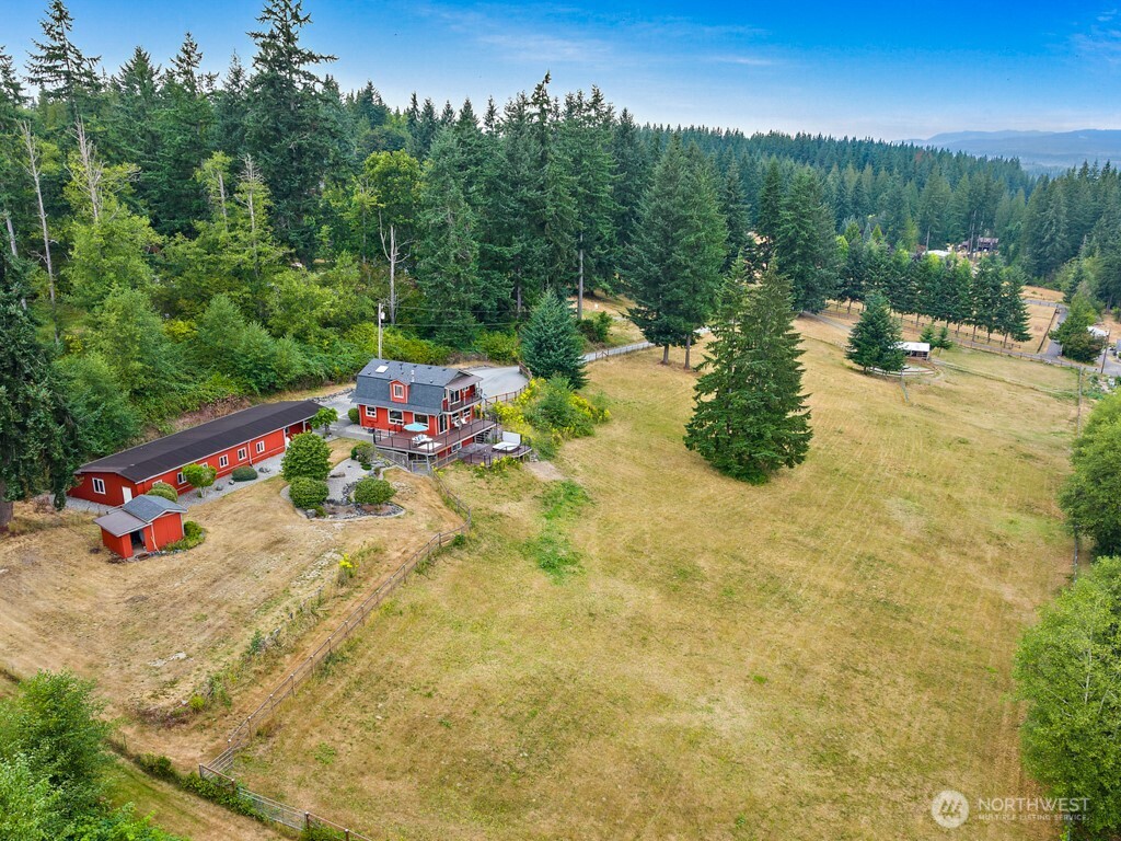 Escape to your own private equestrian sanctuary! Nestled in one of the area’s most desirable locations, this property offers lovely 4-bedrm barn-style home, 5 usable acres w/2+ stall barn, 60’ riding arena, sprawling dry pasture, 2400sf shop/garage & lrg garden shed. Incredible 2200sf home boasts open concept living, chef-inspired kitchen w/SS appl, 2 Primary bedrms, 2 guest rms & 3 lrg decks w/breathtaking mtn views. Estate is is on pristine rolling acreage ideal for your equestrian dream or hobby farm. Possible rental income w/stalls & pasture. Incredible location in coveted 7 Lake Community w/easy access to town, I5, schools. Enjoy the true rural feel this incredible estate offers along w/privacy & plenty of room to call your own. No HOA