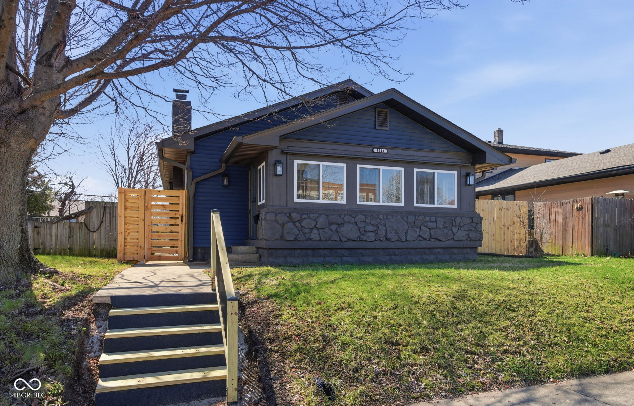 At 1611 Main ST in BEECHGROVE, IN, a distinguished single family residence, established in 1924, stands ready to inspire a new way of living. This inviting home offers a unique blend of enduring character and practical design, poised for its next chapter. The single story design, encompassing 1194 square feet of living area, provides a cohesive environment for daily routines. This thoughtfully arranged space invites moments of comfort and tranquility throughout. Everything is new: appliances, HVAC, water heater, sump pumps, windows, doors, newer roof, gutters, and siding. New electrical and plumbing. Within this inviting layout, three bedrooms offer personal retreats, each providing a quiet haven for rest and rejuvenation. Two full bathrooms ensure convenience and comfort for residents, supporting a harmonious daily rhythm. The property occupies a generous 4617 square foot lot, providing an expansive outdoor canvas for personal expression and enjoyment. This distinguished single family residence offers a captivating blend of historical character and practical comfort, awaiting its next chapter.