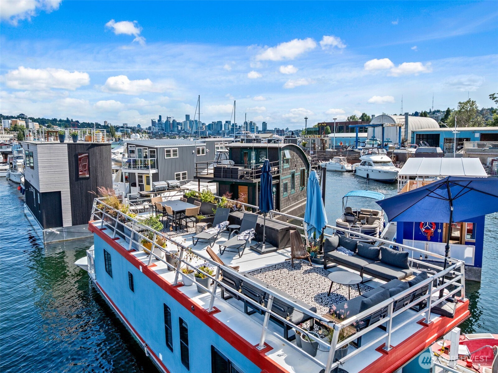 Live life on the water in the heart of Seattle! Welcome to Retreat, a rare opportunity to own a charming houseboat nestled on the north shore of Lake Union. This floating home blends city living with a nautical lifestyle—enjoy morning coffee on your 697sqft rooftop deck, stunning lake and skyline views, and front-row seats to Seattle’s iconic seaplanes, sailboats, and sunsets. Thoughtfully designed for efficient living, the interior offers cozy comfort, clever storage, and bright natural light. Step outside to kayak, paddleboard, or bike the nearby Burke-Gilman Trail, or stroll to Fremont and Wallingford’s shops and eateries. Secure moorage, vibrant houseboat community, and unbeatable proximity to downtown make it the best of both worlds.
