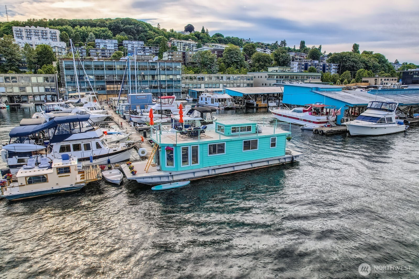 Welcome aboard 'Ginger'—your floating oasis at the End of the dock on Lake Union in the open water and NO obstructed views. This modern Seattle houseboat offers a rare lifestyle on the water with stunning views from the expansive rooftop deck. Featuring a queen bedroom, queen sleeping loft, washer/dryer, and clever storage throughout, it lives large—ideal as a full-time residence or weekend getaway. Low annual taxes and insurance make this an affordable adventure. Paddleboard, kayak, or just relax—Ginger is more than a home, it’s a lifestyle. Aluminum 55' X 15' Hull! Moorage includes liveaboard status $2,125/mo includes water, garbage, and power. Survey inspection is available for a fast closing. Financing available. No rentals.