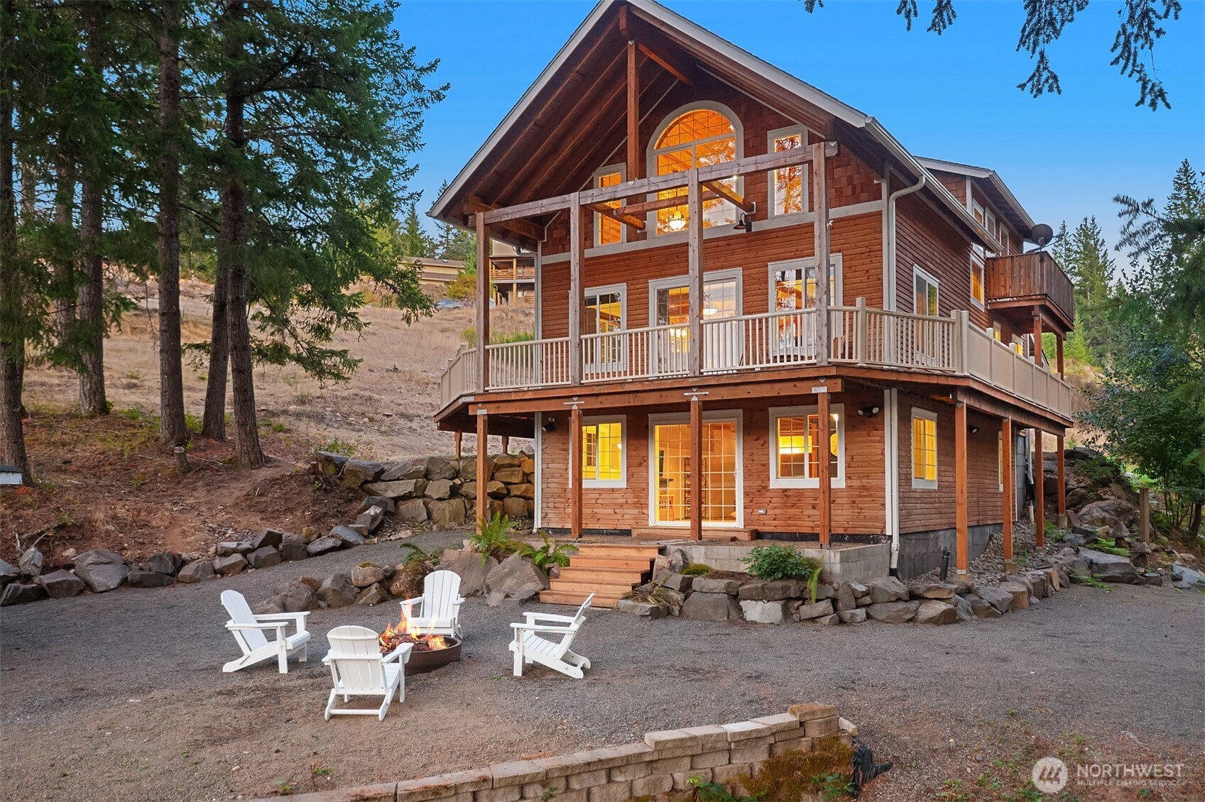This spacious Packwood retreat has it all – including a massive Mt. Rainier view! Sited on an acre within the gated Hellem Dr, this 3-bed, 3-bath home is conveniently located under a mile from Packwood town center. You’ll love the home’s mountain vibe with abundant real wood throughout, durable LVP flooring, updated kitchen, updated baths – one on each floor – and the towering, vaulted chalet windows in the main living room. The lower level is the perfect flex space for a game room and ski tuning shop. The acre features 2 RV power hookups plus 1 full RV hookup, a detached bunk room, storage shed, and a detached bath house with extra laundry hookups. Don’t miss the opportunity to own one of Packwood’s coolest and most well-appointed chalets!