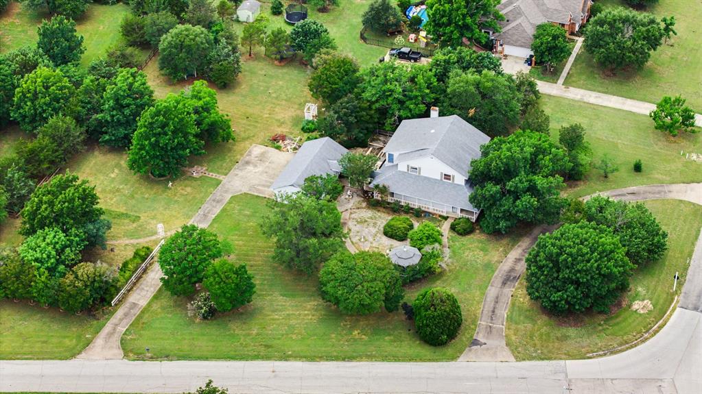 Click the Virtual Tour link to view the 3D walkthrough. Nestled on 1.72 beautiful acres, this two-story home in a gated community offers the perfect blend of space, comfort, and outdoor enjoyment. A welcoming living room greets you upon entry, while a spacious great room provides additional living space and access to the screened-in porch. The kitchen opens to the dining area featuring built-in cabinetry, creating a functional layout for everyday living and entertaining. A convenient laundry room and first-floor bedroom add flexibility to the main level. Upstairs, the primary suite features a private full bath and is accompanied by two additional bedrooms. Outside, the picturesque grounds offer plenty of room to relax and enjoy nature, complete with a covered patio, gazebo, detached two-car garage, and workshop. With abundant indoor and outdoor living space, this property presents a wonderful opportunity to enjoy country living with the convenience of a thoughtfully designed home. Home is being sold in as-is condition.  Easy access to I-75. Discounted rate options and no lender fee future refinancing may be available for qualified buyers of this home.