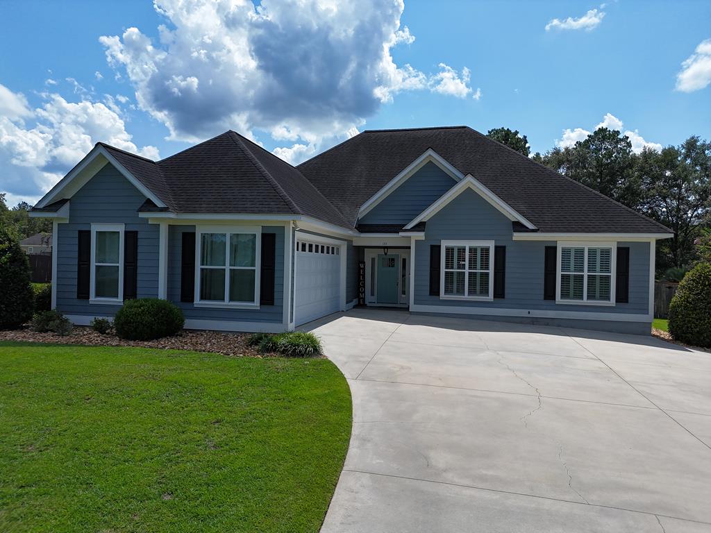 Don't miss your chance to own this EXTRAORDINARY home in Heard's Pond, Thomasville, GA! This beautiful 3BR/2Bath home has it all. Inside you will find wonderful open living space with ornate ceilings and pillars, a wonderfully modern kitchen, amazing primary suite with luxury bathroom, and big laundry room. The exterior is painted the PERFECT blue, accented by great plantation shutters and professional landscaping. You will love the HUGE front lawn, fenced backyard, and 2 car garage – ideal for all your vehicles, toys and storage needs. All this in a quiet, pet-friendly neighborhood. It's out of town with in-town amenities such as high speed internet, trash pickup, utilities, etc..Call your favorite Realtor TODAY for a closer look at this extraordinary home.
