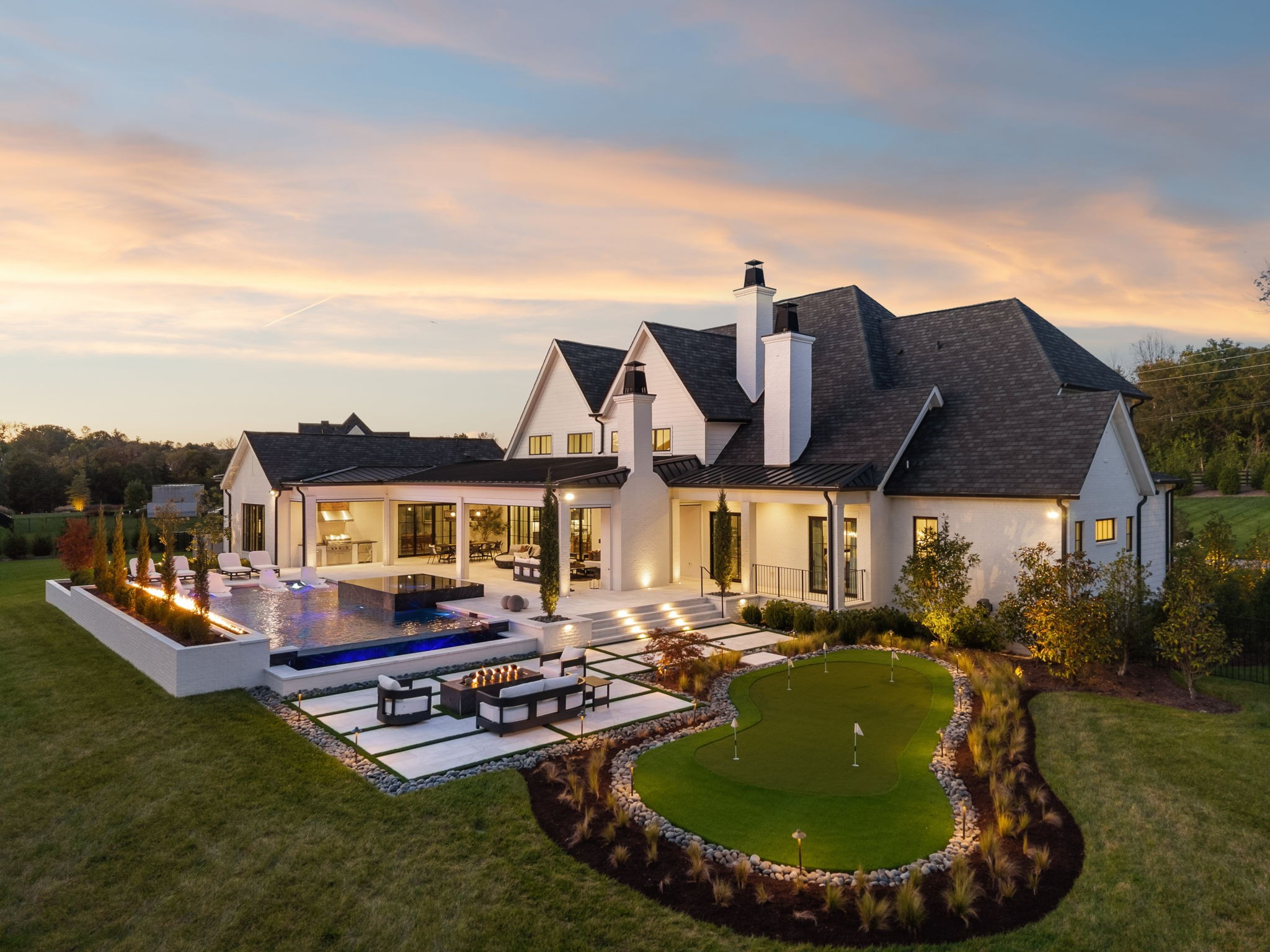Parade of Homes Masterpiece in Brentwood: Experience the pinnacle of modern Southern living in this award-winning estate from the 2022 Parade of Homes, where architectural artistry meets unmatched innovation. Set on two pristine acres in one of Brentwood’s most sought-after enclaves, this residence exudes timeless elegance and effortless functionality across 7,189 square feet of refined space.Inside, over 5,000 square feet unfolds on the main level—a rare luxury that includes three spacious bedrooms, a bonus room, and an elevator for seamless access. Every detail is elevated by an exclusive Wolf/Sub-Zero appliance suite featuring three ovens, four dishwashers, an automated wine dispenser, and built-in Wolf coffee system—all integrated into a kitchen designed for both culinary mastery and sophisticated entertaining. The home’s fully automated systems—from lighting to drapes—bring convenience and comfort to every corner.Extending the living experience beyond the home, a $1 million backyard transformation redefines resort-style living, offering more than 2,000 square feet of heated, covered space designed for year-round enjoyment. A full outdoor kitchen, motorized screens, fire pit, and a show-stopping pool and spa with tanning ledge, firewall, and putting green come together in a setting that feels both luxurious and effortless.This Brentwood estate is more than a home—it’s a showcase of craftsmanship, technology, and design, created for those who expect the extraordinary.