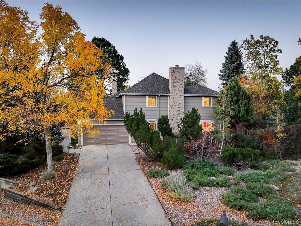 Welcome home to this inviting, transitional family home on an oversized corner lot in the sought after Foxridge neighborhood!Lush perennial gardens and two patios provide a lovely backdrop for exceptional indoor/outdoor Colorado living. The updated kitchen features quartz countertops, bar seating and a charming breakfast area with double doors opening up to a private patio - perfect for morning coffee or casual dining. A gas fireplace anchors the  adjacent family room, while the formal living and dining rooms offer additional space for family gatherings and entertaining. Upstairs, the spacious primary suite features a remodeled full bath and walk in closet. Three additional bedrooms provide comfortable accommodations, while the versatile bonus room offers possibilities of a playroom, study space, or home office. Convenient upstairs laundry room adds to the home's everyday functionality. The finished basement expands your living options with a dedicated TV room and a flex space for office, workout area or hobbies. Thoughtful updates throughout completes  the home's timeless style, while brand new exterior siding enhances the home's curb appeal. Located in the highly desirable Cherry Creek school district, this home is just a short walk to Foxridge Park and The Club at Foxridge, which offers optional memberships to enjoy pool and tennis amenities. The home's  ideal location provides convenient access to the  Denver Tech Center, the greater Denver metro area, major highways, restaurants and shopping. Discover the spacious living, beautiful yard and desirable Foxridge location that makes this home truly special.