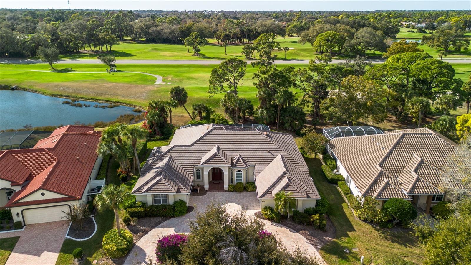 Welcome to refined Florida living in the heart of Calusa Lakes, where timeless craftsmanship, thoughtful exterior improvements, and tranquil golf-course views come together in perfect harmony. This custom-built residence offering approximately 2,700 square feet under air is designed for both everyday comfort and effortless entertaining, beautifully positioned along the 18th fairway.Inside, the home offers three generously sized bedrooms, two well-appointed bathrooms, and a versatile den/office featuring custom built-in cabinetry—ideal for working from home or creating a private retreat. The open-concept floor plan seamlessly connects the spacious kitchen, living, and dining areas, enhanced by abundant storage and natural light, making the home equally suited for intimate evenings or larger gatherings.The primary suite serves as a true sanctuary, offering ample space and serene views of the landscaped grounds and golf course beyond. An oversized laundry complete with extensive storage, and a separate utility room provides flexibility that could easily be reimagined as an exercise or hobby room.Outdoor living is elevated by a paver-brick screened lanai, where expansive fairway views create a peaceful backdrop for morning coffee or sunset entertaining. Recent upgrades provide peace of mind and lasting value, including a new roof, paver driveway, and permanently installed hurricane shutters.The home is located within Calusa Lakes Golf Club, a gated golf community nestled within 480 wooded acres, featuring over 20 scenic ponds and 575 custom-built homes. Residents enjoy an 18-hole championship golf course, clubhouse with dining, four Har-Tru tennis courts, low HOA fees, and no CDD fees. Golf membership is optional, not mandatory, offering flexibility rarely found in golf-course communities. The location is ideal—just minutes to the Legacy Trail and only two stoplights to Nokomis Beach.This exceptional property offers the perfect blend of privacy, quality construction, thoughtful upgrades, and an unmatched Nokomis lifestyle—where nature, convenience, and elegance meet.