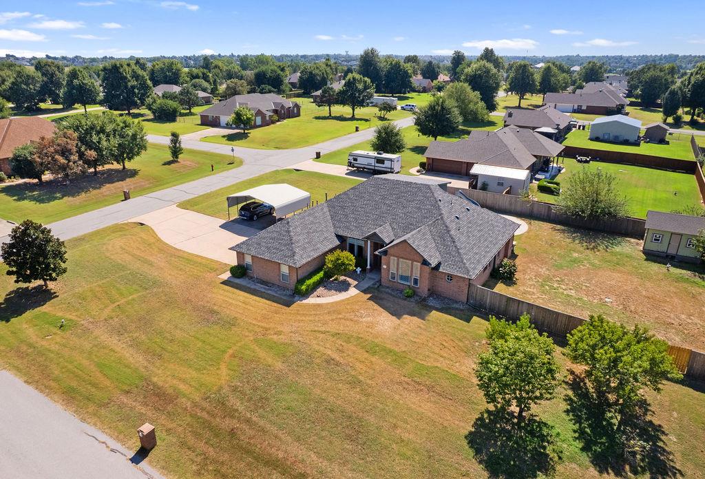 Located in Edmond on over half an acre, this spacious home offers versatile living with room to grow and enjoy both inside and out. The interior features five bedrooms plus a flexible sixth space that can serve as a home office, theater, or hobby room, giving you multiple options for work and leisure. The primary suite is set apart for added privacy and includes an updated bathroom remodeled in 2019. With a 400sf attic conversion completed, the upstairs now provides additional bedrooms and usable space, while thoughtful updates throughout—such as new air conditioning units and water heaters in 2024—ensure comfort and efficiency. Don’t miss out on standout upgrades including a storm shelter, annual HVAC & termite inspections plus a recently replaced roof in 2025 for added peace of mind. Outside, enjoy a covered cedar deck built in 2019, perfect for relaxing mornings or entertaining evenings, along with a fiberglass in-ground pool with a slide and custom cover for endless summer fun. The property also provides an extra covered parking pad, a sprinkler system, and a well-maintained septic system serviced by Red Dirt Septic. Don’t forget about the expansive yard that gives you the freedom to create your ideal outdoor retreat, whether for gardening, recreation, or quiet relaxation. This well-cared-for home combines space, updates, and outdoor living in one exceptional Edmond location; making it a rare opportunity you’ll want to see in person.