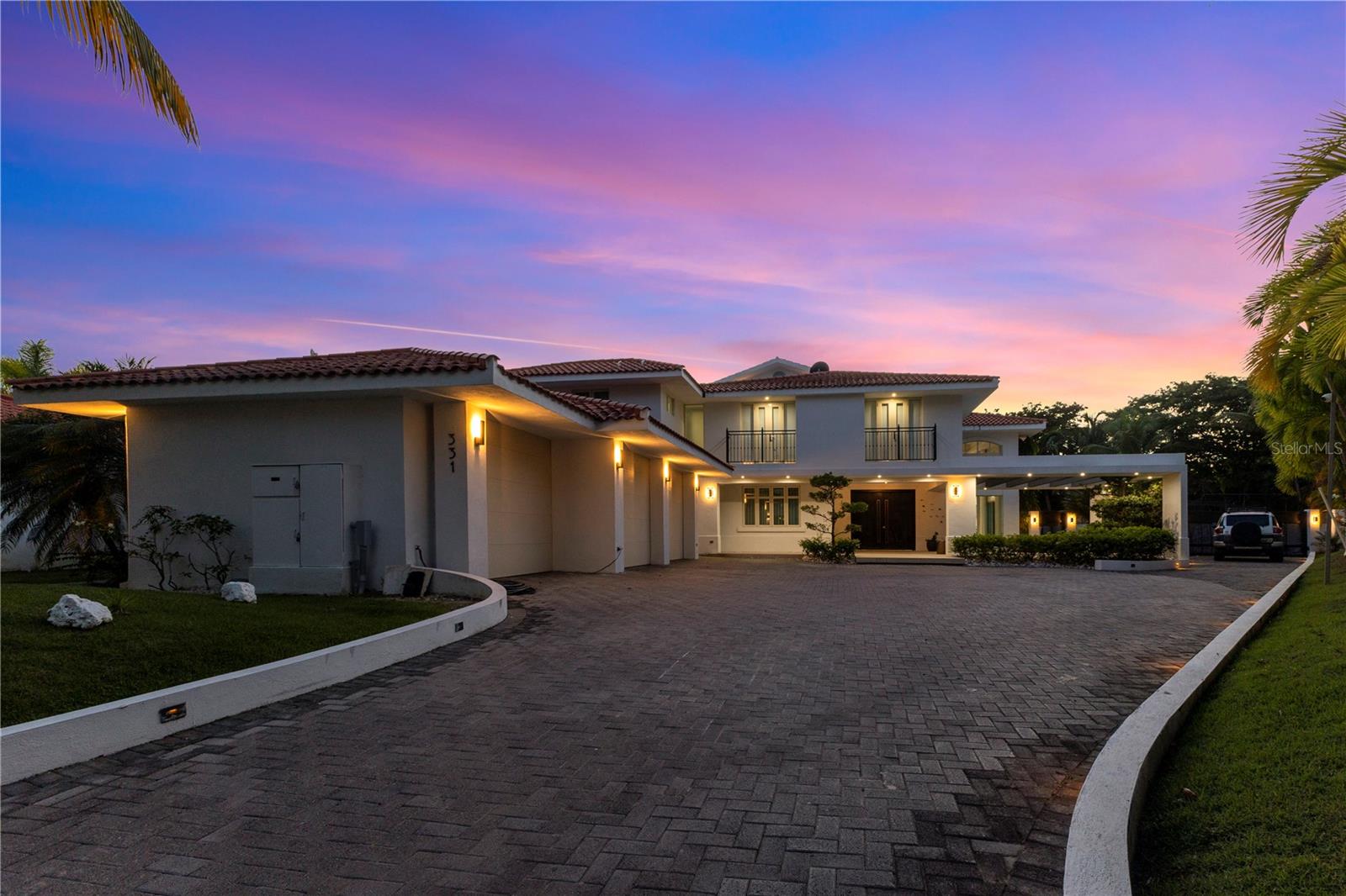 Behind the guarded gates of Dorado Beach East, on one of the largest lots in the community, this residence claims a rare footprint: 22,908 sq ft of land, 12,112 sq ft of total built area, and 7,932 sq ft of living space. Built in 2003 and held privately since, it sits on high ground outside the special flood hazard area, an increasingly scarce combination on Puerto Rico's north coast.Inside, a sunlit foyer opens beneath a sculptural spiral staircase that anchors the home. The gourmet kitchen was built for someone who actually cooks, and it opens directly into the living and dining areas, which in turn flow out to the terrace so the entertaining space effectively doubles when the doors are open. Five bedrooms, each with its own en-suite bath, give every guest a private wing of their own. The primary suite goes further, adding a spa-inspired bathroom, a private mezzanine gym and a terrace of its own. With seven full baths and a powder room in total.The outdoor space is the argument for the lot. A pool sits framed by mature tropical gardens, alongside a full outdoor kitchen and grill, with room left over for shade, seating and play. The house is equipped for real island living: a three-car attached garage , a cistern system, a whole-house generator and an integrated security system, so the property runs through storm season without improvising.Dorado Beach East remains one of the island's most established guard-gated addresses. Residents have a private social club with pool, tennis courts, soccer field and park, and are minutes from world-renowned golf, the Dorado Beach Ritz-Carlton Reserve and the beaches that made Dorado what it is. HOA $1,095 monthly. CRIM: 12,656 annually. Garage: Yes | Attch: Yes | Spcs: 3Showings by appointment.