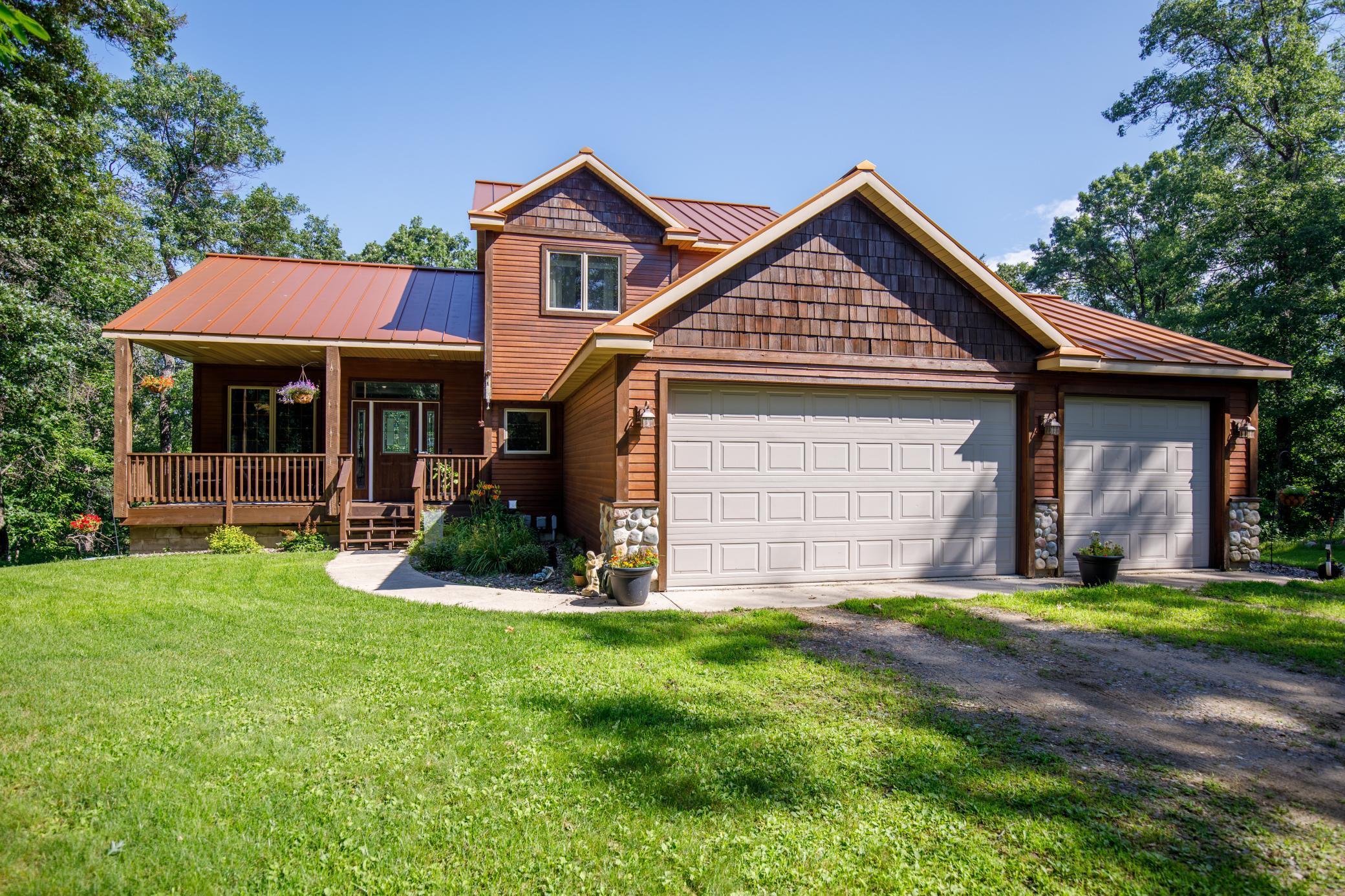 Experience upscale lake country living in this stunning 5-bedroom, 3-bath home, perfectly positioned just outside Breezy Point. With an open-concept main level, the home showcases executive finishes throughout—including custom hickory cabinetry, stainless steel appliances, granite countertops, and a spacious center island ideal for entertaining.

Enjoy tranquil lake views and frequent wildlife sightings from the expansive deck, or cozy up inside by the beautiful stone gas fireplace.

The fully finished lower level offers a generous walkout space and is already stubbed for a fourth bathroom—adding flexibility and future potential. An oversized, attached 3-car garage provides ample storage for all your lake and golf gear.

Enjoy all the perks of lakeside living without the waterfront taxes. Just minutes from public landings on Pelican Lake, Ossawinnamakee, and the Whitefish Chain—plus golf, dining, and entertainment in Breezy Point.