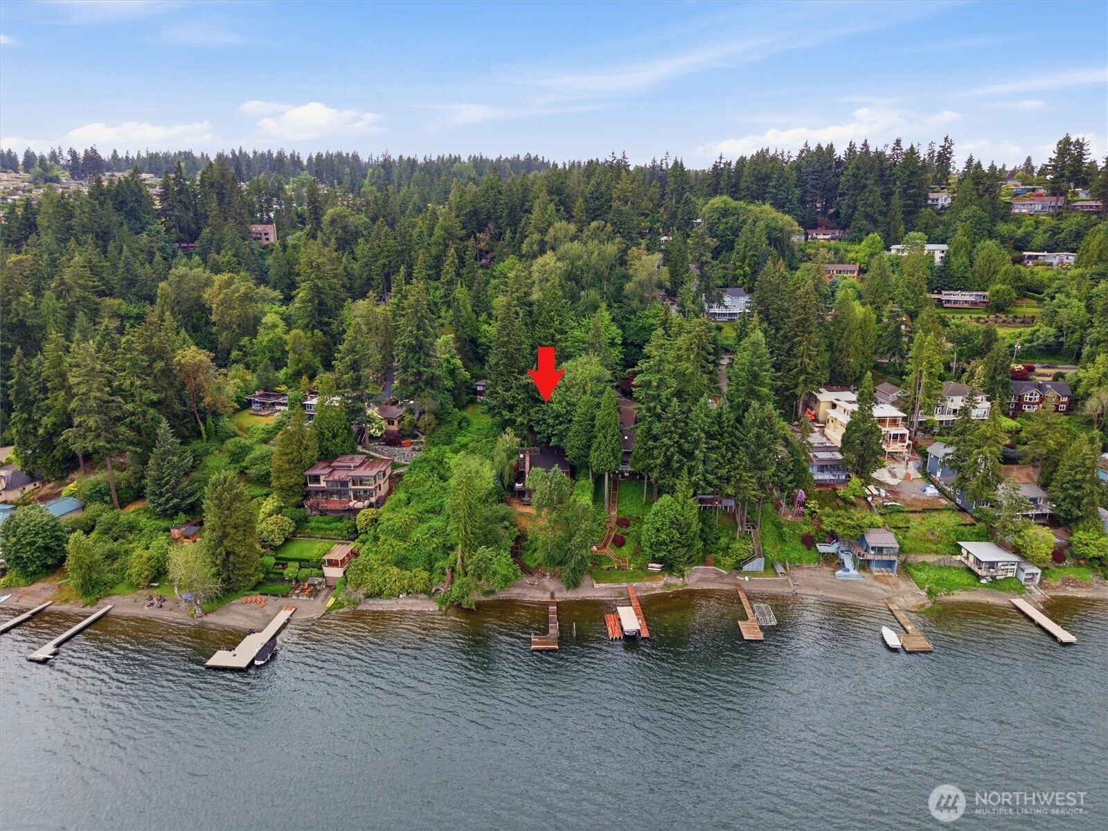 Rare waterfront. Endless potential! Offered for the first time in 37 years, this exceptional West Lake Sammamish property presents a exceptional opportunity to own .60 acres with 80 feet of waterfront. Privately tucked off the Parkway on a street-to-lake lot, the setting offers remarkable privacy and endless possibilities. The solid, original NW contemporary multi-level home provides a wonderful foundation to renovate, reimagine, or create a custom luxury lakefront estate. Designed around this extraordinary setting. Enjoy a private dock with boat lift, expansive sandy beach, and three lakeside decks offering effortless indoor-outdoor living- from peaceful mornings on the water to unforgettable summer entertaining. The generous parcel provides flexibility for future design, expanded outdoor living, and additional possibilities. A detached two-car garage adds immediate functionality with room to adapt the property to your vision. An exceptional opportunity for an end-user, builder, or investor seeking a true Lake Sammamish legacy property in one of the Eastside’s most coveted waterfront locations. Convenient access to Downtown Bellevue, Microsoft, Meta’s Spring District, Nintendo, Google’s Kirkland campus, and nearby Overlake light rail. Pre-inspected with report available. “Moving to Lake Sammamish, the BEST move you’ll ever make!”**