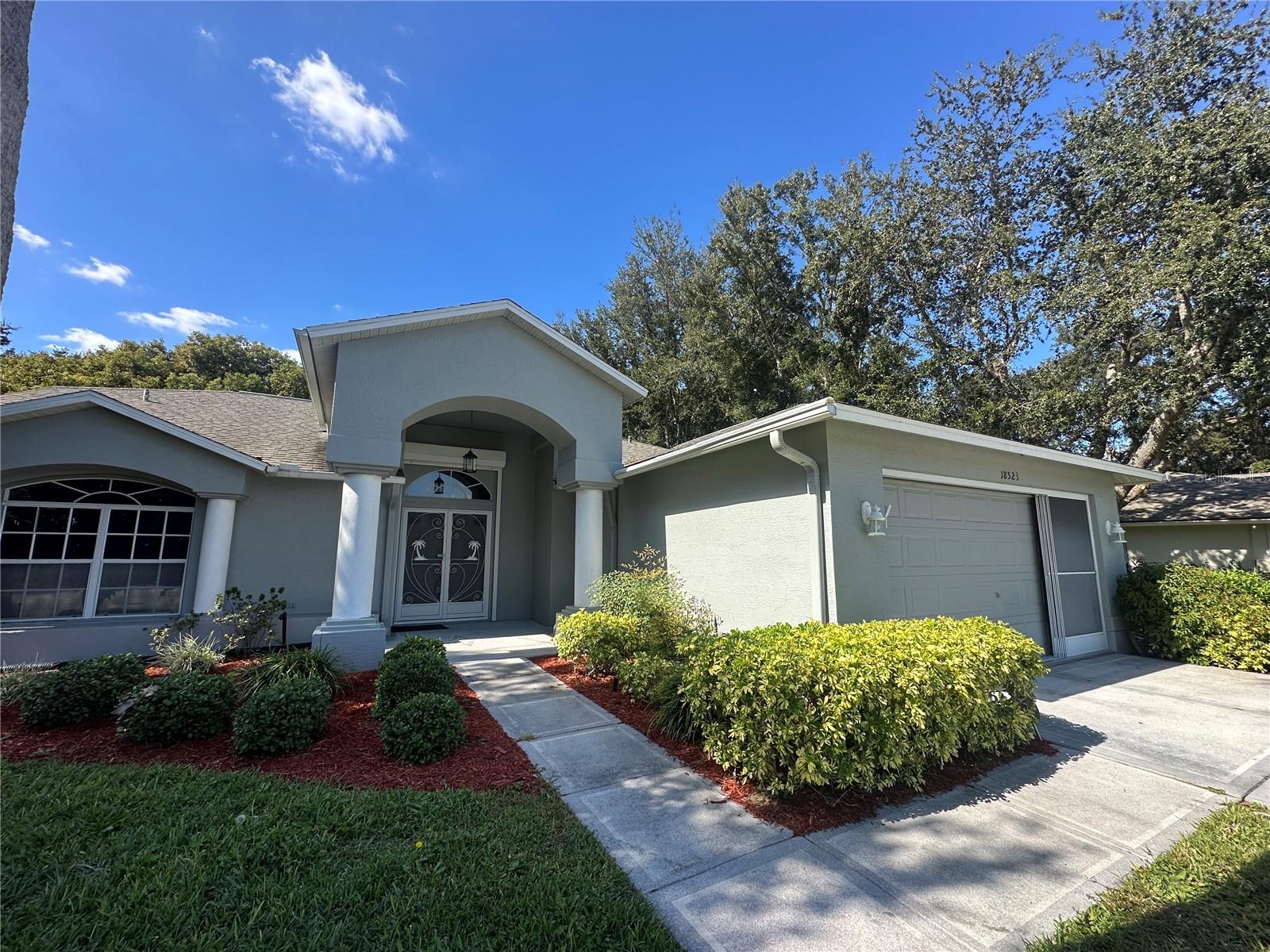 Move-In Ready & Exceptionally Maintained – Heritage Pines 55+ Golf Community Don’t miss this beautifully cared-for home offering bright, open living in one of Florida’s most desirable active adult communities. Step inside to a light-filled interior with soft neutral tones and a flowing, open floor plan. The split-bedroom layout provides comfort and privacy, while the spacious great room connects seamlessly to the kitchen—perfect for entertaining. Enjoy cooking in your inviting kitchen with newer appliances, and unwind in this home’s lanai overlooking a peaceful conservation area—no rear neighbors for ultimate privacy! This home also offers a fantastic spa-like atmosphere ideal for relaxation and rejuvenation—your own private retreat in a tranquil, serene setting. Additional highlights include a water softener system and a new sliding glass door for added peace of mind. Heritage Pines offers resort-style living with a championship golf course, clubhouse, heated pool, beautiful restaurant, woodworking shop, tennis, pickleball, gaming room, craft room, performing arts center, and numerous clubs and activities. Just minutes to beaches, shopping, dining, medical facilities, and an easy drive to Tampa or Clearwater via the Suncoast Parkway. This is a must-see home—you will not be disappointed!