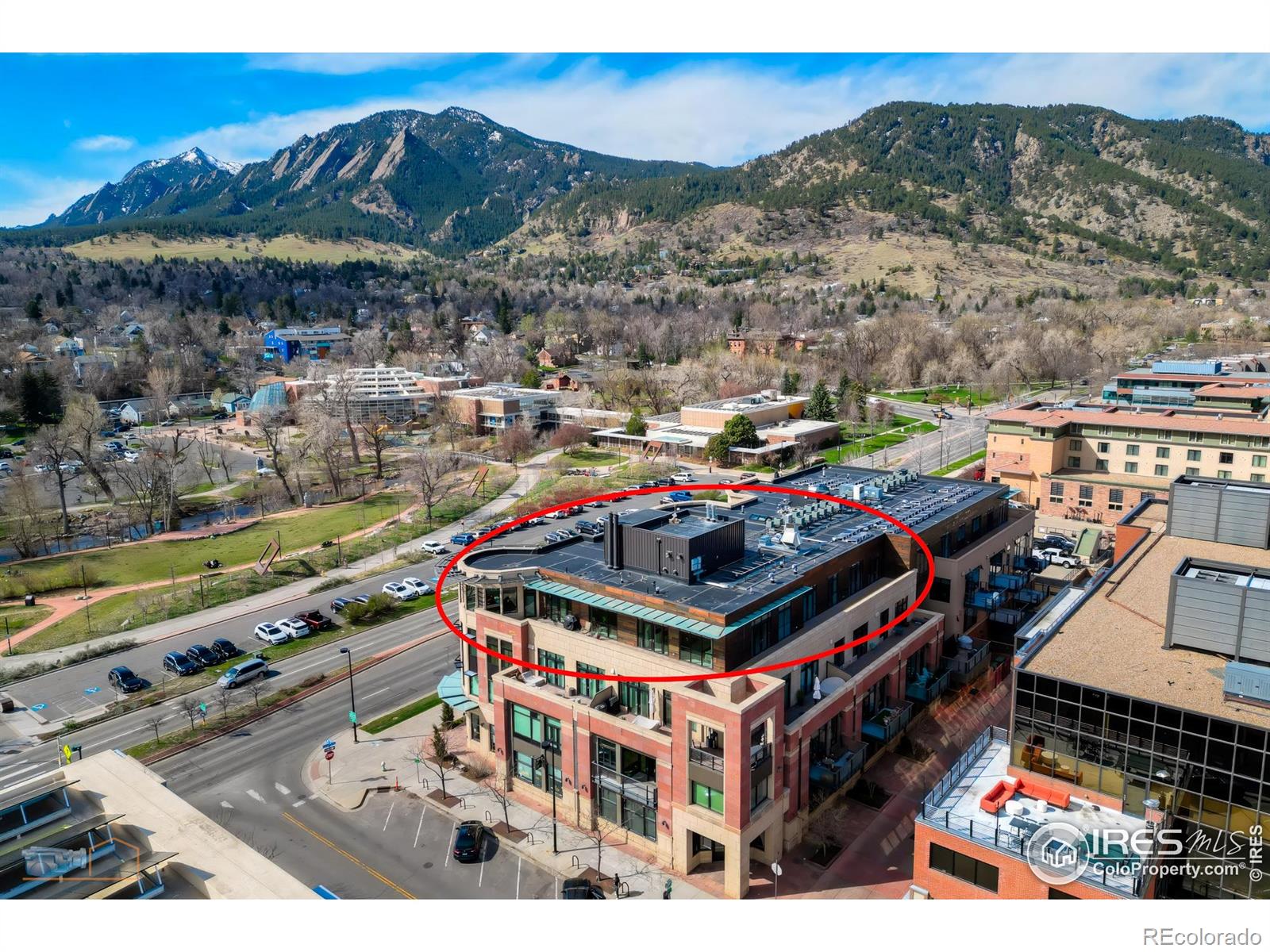 Considered by many to be the finest residence in downtown Boulder. Stunning 4415 sf penthouse in the Arete with floor-to-ceiling panoramic views above tree line to the Flatirons, Central Park, Boulder Creek, Folsom Stadium, Chautauqua and Pearl St. Mall. And all of downtown within steps or viewed from a 1400sf wrap around patio. This build-out, only finished in 2018, features a rare turret style living room of convex architecture providing full vistas 24/7 without the need to be outside. The turret, with expansive windows, floods the living space with abundant sunshine. An inviting open-concept layout seamlessly merges the kitchen, dining, and living areas, making entertaining and socializing a central focus. Moros Fabrication cut and installed the large Pental slab quartz kitchen island and natural stone granite countertops. Wolf double ovens and range top, Sub-Zero refrigerator, custom cabinetry, bespoke range hood, and wine cooler make this kitchen truly a haven for culinary enthusiasts. The family room with custom fireplace and marble mantel, provides a cozy retreat while keeping the mountains in view. Adjacent home office with built ins. The generous primary bedroom will not disappoint, with recessed cove lighting, TV/fireplace and library wall. Luxurious spa like bathroom, additional primary vanity & an expansive walk-in closet. All 3 additional bedrooms have ensuite bathrooms, granite counters and direct access to the 1400sf wraparound patio that enjoys late day sunshine. 15 patio doors w/screens in 3 directions provide natural air flow throughout. Abundant and discrete storage everywhere plus this penthouse comes with a 150sf storage room in the garage. The unit comes with 3 dedicated underground parking spaces with additional parking available for guests. Elevator access to all floors. The Arete is an elite building and certified as Silver Leeds consistently drawing the highest resale prices in Boulder since opening in 2009.