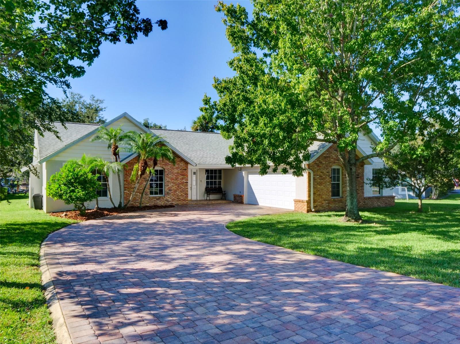 Great Ski Lake opportunity! This quiet tucked away location on Prairie Lake is an "in town" location close to shopping, restaurants, and major roadway access. No HOA and no thru traffic on a dead-end street. This home has new laminate vinyl flooring throughout, newly renovated kitchen and baths, with new stainless GE kitchen appliances. A large paver driveway and a side entry double garage make the front elevation of the home attractive. The interior spaces are light and airy with both vaulted and cathedral ceilings. The great room space overlooks a big rear yard to the lake and boathouse. The large GR/Florida room space could be remodeled giving you a "mother in law" space or a 4 bedroom. Both the front yard and rear yard have mature shade trees. A large paver patio space off of the great room, gives additional outdoor enjoyment. The boat house and dock also have a built-in concrete boat ramp for launching and retrieving equipment on your own property. The boat house features a cradle boat lift for under the roof boat storage. Prairie lake is a clean clear lake that is ideal for boating, fishing, and skiing activities.