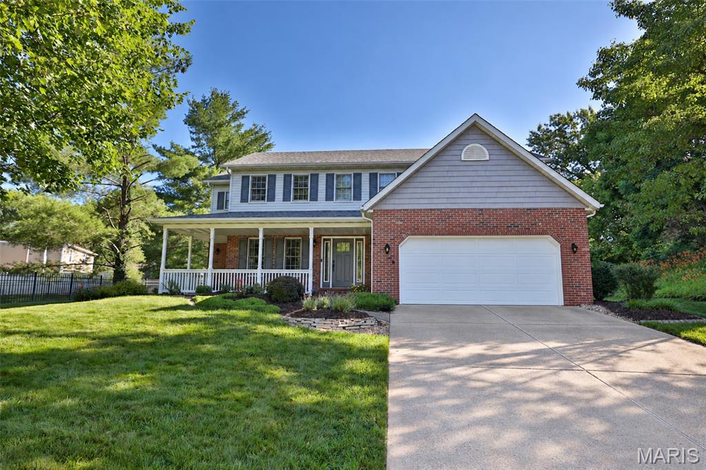 Lovingly maintained by its original owner, this beautiful custom two-story home is tucked away on a quiet cul-de-sac, offering timeless curb appeal, generous living spaces, and thoughtful details throughout. The welcoming covered front porch introduces a home designed for comfortable everyday living and effortless entertaining.Inside, you'll discover a wonderful combination of formal and casual gathering spaces, including a spacious living room with gas fireplace and custom built-in cabinetry and shelving, formal dining room, and an inviting hearth room featuring a gas fireplace. Warm woodwork, beautiful hardwood flooring, and abundant natural light create an atmosphere of timeless character.The updated kitchen features granite countertops, beautiful cabinetry, stainless steel appliances, a gas range, built-in oven and microwave, and a convenient breakfast bar overlooking the adjoining hearth room. This exceptional gathering space, added in 2001, features a vaulted ceiling, a second fireplace, and distinctive arched windows that fill the room with natural light. The combination of the traditional family room and the vaulted hearth room provides two wonderful spaces to gather, entertain, or simply relax. With lovely backyard views and convenient access to the outdoor living areas, the hearth room is sure to become a favorite destination within the home.On the upper level, four generously sized bedrooms offer comfortable accommodations, including an exceptionally spacious primary suite. The private ensuite bath features a whirlpool tub, separate shower, double-sink vanity with Cambria countertops, linen storage, and a walk-in closet. Plantation shutters add a timeless finishing touch. An additional full bathroom features an updated vanity and tiled tub surround. A rear staircase provides convenient access between levels, while upstairs laundry hookups offer the flexibility of a second laundry location.The partially finished lower level provides additional space for recreation, hobbies, or entertaining, complete with a full bathroom.Outdoor living is equally impressive! The beautifully landscaped, fully fenced backyard features an expansive patio with multiple seating and dining areas, a fire pit, and mature landscaping that creates an inviting setting for outdoor gatherings. The charming covered front porch, attractive brick accents, and two-car garage complete the exterior.Additional features include dual HVAC systems providing zoned heating and cooling. A beautifully cared-for, one-owner home offering an exceptional floor plan, two inviting fireplace gathering spaces, and wonderful indoor and outdoor living in an established Edwardsville cul-de-sac setting.