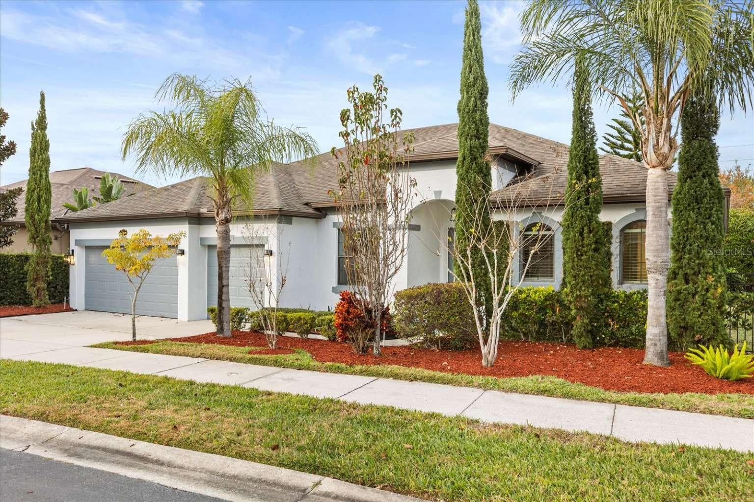 Gorgeous 4 bedroom + 3 full bath Smart Home featuring an oversized corner lot with separate private office (can be used as a 5th bedroom) at the desirable 'Enclave at Tuscany' in the heart of Lake Mary is now ready for you! So many added features are included in this Single Story 3-way split plan home with high ceilings. Upon entry, discover the Office on your left with locking french doors. Continuing through the home is the spacious dining area leading to the kitchen, nook, and family area. The Kitchen is perfect for entertaining and cooking appointed with solid granite counter tops, an over six foot long island with seating area, 42-in cabinets, high end stainless steel appliances with built-in double ovens, white marble backsplash and a large walk-in pantry. The whole house AO Smith water filtration and softener system in addition to washer and dryer is also included. The Breakfast Nook has wonderful solid built-in plantation shutters. Open concept kitchen, nook, and living room leads to the additional Office/Flex tied into the 4th bedroom with en-suite full bathroom with its own exterior entrance, great for in-laws, a second Master or additional income.Three sliding tempered glass and UV tinted doors from the (1) Living Room, (2) Dining Room and (3) Master Bedroom take you to the enclosed Florida room renovated with crown molding, an oversized ceiling fan and 4 double french doors and built in glasswork allowing you to step directly outside to a backyard private oasis, perfect for alfresco dining and relaxation under a custom-built pergola adjacent to your own Pomegranate, Fig and Avocado trees. Ideally located near top-tier schools, gourmet dining in Heathrow, and upscale shopping in Colonial Town Park and equidistance to either 417 or I-4 within 2 Miles of the House. This home perfectly balances convenience and luxury. The Primary Bedroom Suite has has an impressive 14' long walk-in closet which can be accessed from both the bedroom and bathroom. Step into your own retreat in this thoughtfully planned Master Bath, which boasts an oversized Step-in Shower with dual stainless steel Shower heads, Garden Tub and 2 vanity sinks with multiple windows and perimeter solid Granite Counter tops. The 3-car garage was recently painted top to bottom and is ready for your multiple toys, Ethernet pre-wired throughout the home, and Argon gas filled low E/Vinyl Energy efficient noise reducing windows. Conveniently located minutes from the Mayfair Country Club & Golf Course, Cross Seminole Trail, Colonial Town Park, 30 Minute drive from Orlando MCO Airport and A rated Seminole County Schools! Come visit this home and fall in love!