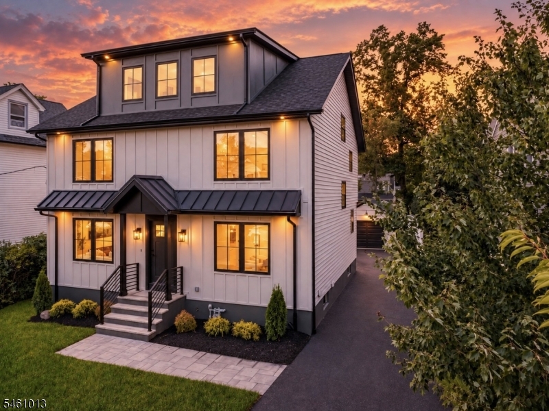Welcome to 233 Cranford Ave, a newly built-from-the-foundation-up custom colonial showcasing high-end craftsmanship and nearly 4,000 SF of beautifully finished living space across 4 levels. This exceptional 5-bed, 3.5-bath home offers luxury, space, and functionality on a quiet cul-de-sac. The main level features an open-concept LR with a striking accent-wall fireplace, spacious dining area, and custom kitchen with two-tone cabinetry, high-end JennAir appliances, premium finishes, and a large center island with bar seating. A 1st-fl bedroom offers flexibility as a guest room or home office, complemented by a stylish powder room and direct backyard access. Upstairs, the luxurious primary suite features a spa-inspired bath, while two additional bedrooms share a spacious full bathroom. A 2nd-fl laundry room adds convenience. The 3rd fl offers a versatile loft and private en-suite bedroom with full bath, ideal for guests or a quiet retreat. The finished basement provides plenty of space for recreation, a gym, theater, or entertaining. Outside, enjoy a fenced private backyard and a park with walking and biking trails that sits at the end of the street, just steps from home. Walk to downtown Cranford, schools, shops, restaurants, parks, and NJ Transit. Cranford is known for its top-rated schools, its status as one of New Jersey's best downtowns, and its convenient access to NYC.A rare opportunity to own a beautifully built home in a prime Cranford location.