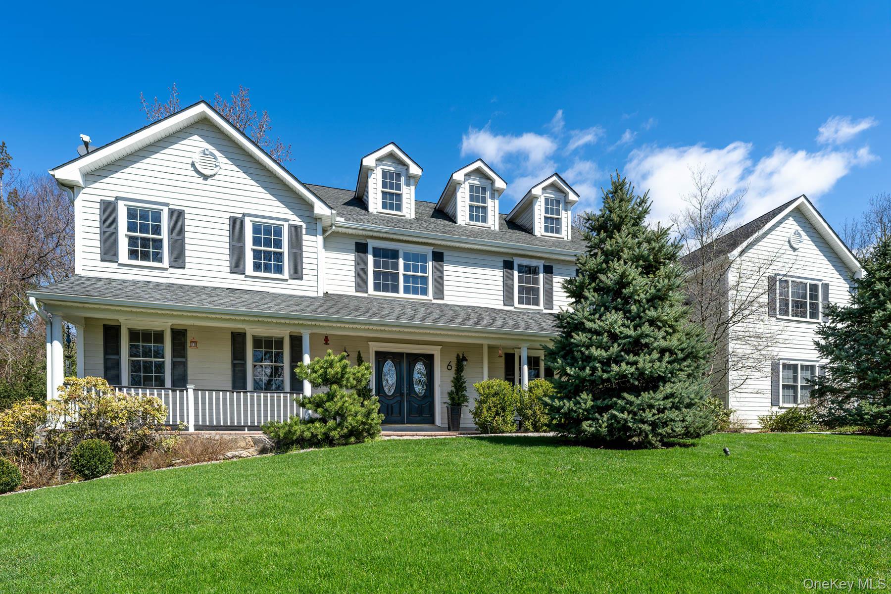 Welcome to 6 Cliff Place, a beautifully updated Center Hall Colonial set on a quiet street in the heart of Armonk. Offering six bedrooms and four baths, this home seamlessly blends classic architecture with modern comfort and effortless living.A bright, gracious foyer welcomes you inside, leading to an oversized living room, formal dining room, and an updated chef’s kitchen designed for the ease of everyday living and entertaining. The home’s open, well-designed layout creates a seamless flow between formal and casual spaces. A first-floor bedroom and full bath offer ideal flexibility for guests or a home office.Upstairs, the expansive primary suite is a true retreat, featuring a sitting area and two gas fireplaces, including one in the spacious en-suite bath. Four additional generously sized bedrooms, an office, and two full baths complete the second level.The finished lower level offers 1,225 square feet of additional living space, including a gym, recreation area, and versatile bonus spaces.Outdoor living is equally inviting, with a flat, beautifully landscaped backyard complete with a patio, built-in grill, gazebo, and tranquil pond, ideal for entertaining or relaxing in a private setting.Located just minutes from town, this home offers the perfect balance of convenience, comfort, and lifestyle in one of Armonk’s most desirable settings.