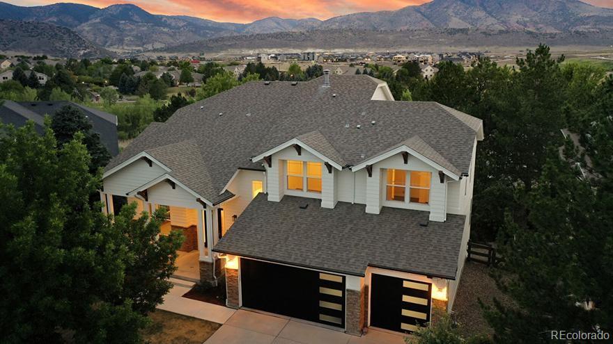 Nestled in one of Green Mountain’s most desirable neighborhoods this gem of a home will not disappoint. These stunning mountain views from nearly every window leave little to be desired as Colorado’s beauty surrounds this move in ready home. Whether you’re entertaining on one of the large patios overlooking the scenery, enjoying the large flat grassed backyard, or cozied up next to the oversized fireplace, this home has more than enough room for everyone. The main floor also offers an updated kitchen with quartz countertops, eat in area, living room with 20 foot ceilings, a home office, a designated dining room, and a bedroom which can be used as an additional office, gym, den or playroom. Whatever your heart desires! On the upper floor, you will find the primary suite complete with a spa like bathroom and large closet designed by California Closets. Down the hall are three additional bedrooms, all with oversized windows and two full bathrooms. On the lower level, this impressive walkout basement offers high ceilings, with a large living area, wet bar, a full bathroom, a bedroom, and a flex room. This home offers easy access to C470, minutes away from historical downtown Morrison, 15 minutes away from the beautiful downtown Golden, 20 minutes to downtown, 30 minutes to DTC Just a short trip down the road to Bear Creek Golf Club and Fox Hollow Golf Course. Don’t miss your opportunity to snag this absolute show stopper. Listing agent has a financial interest in the property.