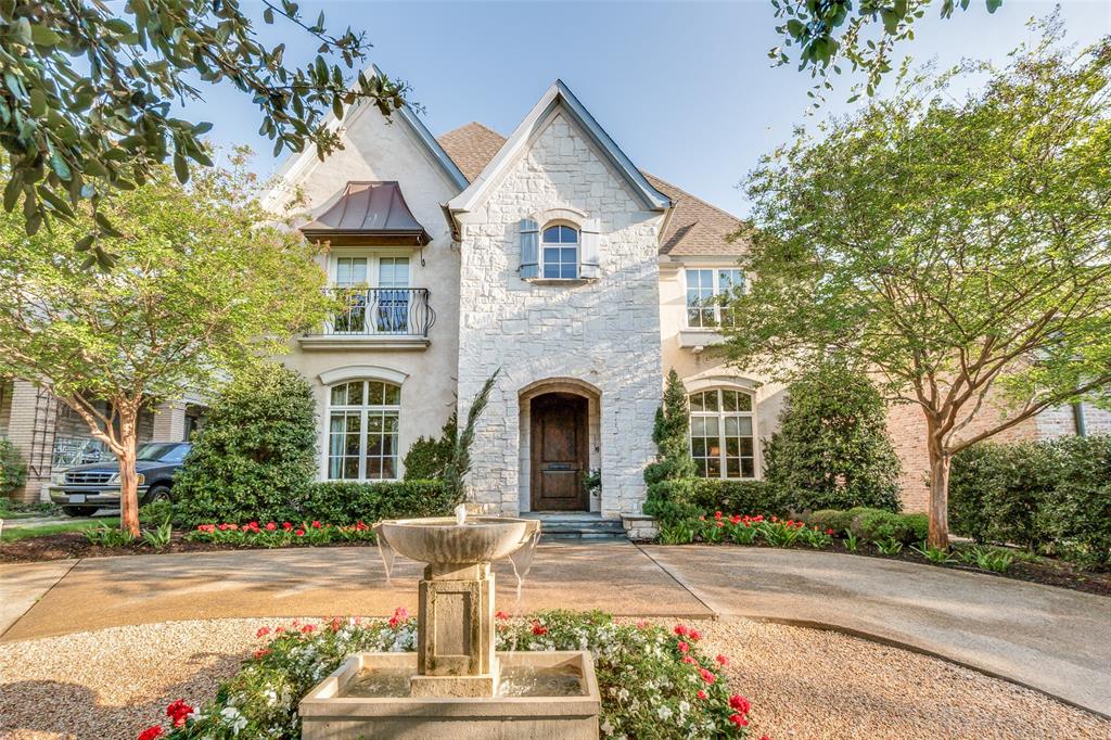 Nestled in the lush heart of the Turtle Creek greenbelt - just south of Highland Park & steps from Turtle Creek Village - this enchanting French-inspired cottage offers 4,902 square feet of warmth, charm, & effortless sophistication. Designed for those who love gracious entertaining as much as the freedom of a true lock-and-leave lifestyle, the home welcomes you with graceful inlaid hardwood floors and generous natural light. The main level centers around everyday comfort & hospitality. A fireplace anchors the living room, opening into the dining room & an inviting gourmet kitchen equipped with a large prep island, Wolf double-oven range, dual sinks, butler’s pantry, & pellet ice maker. A built-in breakfast nook makes morning routines feel special, while a climate-controlled wine room & a dedicated study with custom built-ins add refined convenience. The retractable phantom screens open the living room directly to a covered patio with its own outdoor fireplace, creating a seamless indoor-outdoor sanctuary. Tucked away on the first floor, the primary suite is a private retreat complete with a custom walk-in closet, spa-like bath featuring dual vanities, separate soaking tub & shower, & its own full-size stackable laundry closet. Upstairs, 2 large en-suite bedrooms, a spacious laundry room, & an inviting media room give family & visiting friends plenty of room to unwind. An additional 575-square-foot private guest suite with a full bath sits above the connected garage, offering a flexible retreat for long-term guests, a private home gym, or a quiet creative studio, bringing the home to 4 beds & 4.5 baths total. Out back, low-maintenance luxury takes center stage with an inlaid turfed courtyard, separate gated turfed yard area, charming garden shed, & whole-home generator for complete peace of mind. With the Katy Trail, Turtle Creek Trail, & Highland Park Village just moments away, it delivers the rare blend of neighborhood serenity & vibrant uptown convenience.