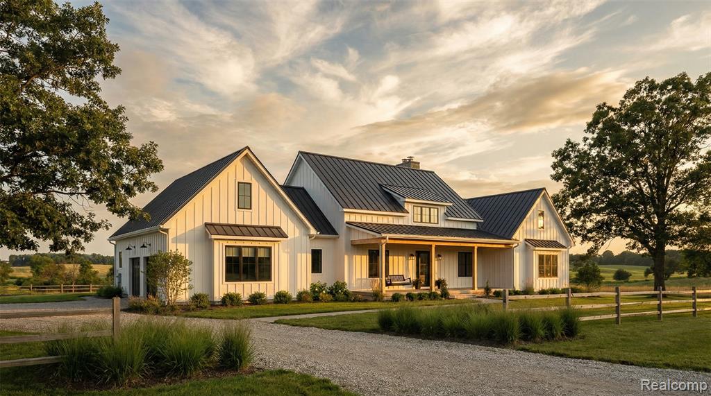 Seven and a quarter acres inside Metamora Hunt Country — one of Michigan's most established and sought-after equestrian communities. A private one-acre pond anchors the rear of the property, stables are already in place, and perimeter fencing encloses the full parcel. To the left, to the right, and beyond: horse properties and equestrian estates. The home is a modern farmhouse to be built in 2026—a heavy addition and full Custom remodel are actively underway, and the buyer who moves now can still select every interior finish. At 3,600 square feet, it has four bedrooms, three and a half bathrooms, and vaulted ceilings throughout the main living area. Board-and-batten siding, a standing seam metal roof, exposed beams, shiplap detailing, wide-plank oak floors, and a chef's kitchen designed for how people actually use a house. This is like new construction, rebuilt for a buyer who wants the Country lifestyle with modern amenities. Seven minutes gets you to downtown Metamora—the White Horse Inn, the General Store, the hunt club. Ten minutes in the other direction puts you in Oxford, with full access to shopping, dining, and services. The location works on both axes. But once you turn down Brauer Road, none of that follows you in.