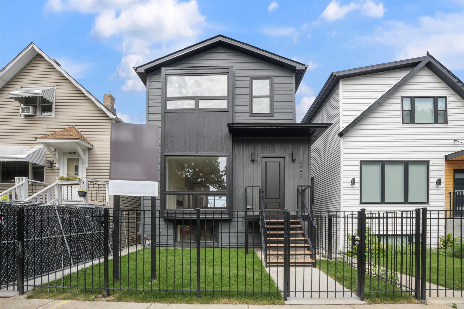 Located less than five blocks From the Logan Square Farmer's Market, this beautifully reimagined home boasts an extra wide interior foot print and designer grade finishes throughout. The Home features an expansive open-concept main level featuring ten foot tall ceilings, white oak hardwood flooring throughout, 8-foot solid core doors, and custom quartzite countertops in the kitchen and powder room.  Some of the upgrades in this home include finished custom closets throughout, heated floors in the primary bathroom, a full height natural quartzite backsplash, and multiple custom built in features. Incredible natural light pours through oversized windows and a thoughtfully placed skylight, highlighting the home's exceptional craftsmanship and airy feel. The kitchen, thoughtfully appointed with Bosch appliances, custom cabinetry, and a large island perfect for entertaining.  Upstairs, you'll find three spacious bedrooms and two luxurious bathrooms, including a stunning primary suite with vaulted ceilings, a spa-inspired bathroom featuring a freestanding soaking tub, double vanity, and a walk-in shower.    The fully finished basement expands your living space with a large family room + Bar, additional bedroom, and full bathroom-ideal for guests or a home office setup. Dual-zone HVAC ensures year-round comfort throughout all three levels.    Enjoy outdoor living with an oversized rear deck, green yard space, and a two-car garage for added convenience. Located under a mile from the Logan Square Farmers Market, you're steps away from some of the best dining, shopping, and community vibes the neighborhood has to offer.    Crafted by an experienced local developer, this is not your typical new construction-every detail has been carefully curated to create a truly special home.