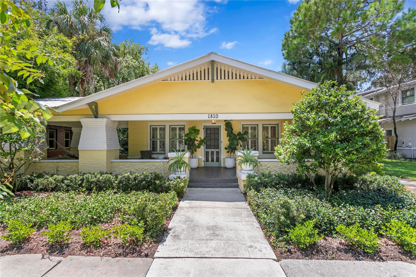 Introducing one of Hyde Park’s most remarkable homes! This beautiful Craftsman-style bungalow in Historic Hyde Park North blends timeless architectural character with more than $200,000 of carefully selected upgrades. The main home offers 4 bedrooms, 3 full baths, and 2,564 sq. ft., while the detached guest house provides 2 bedrooms, 1 bath, and 672 sq. ft. of independent living space—ideal for extended family, long-term guests, or a private retreat. A wide front porch sets the tone for what’s inside. The living room welcomes you with original hardwood floors, French doors, custom built-ins, and a beautiful white brick fireplace that anchors the space with warmth and charm. The flow continues into the dining room and chef’s kitchen, which pairs quartz countertops and stainless steel appliances with thoughtful upgrades like double wine refrigerators and a built-in Miele coffee maker. A new dishwasher (2023) and whole-home water softener and filtration system further elevate convenience and comfort. The main-level primary suite is a private sanctuary, offering a potential sitting area, spacious walk-in closet, and a spa-style bath renovated in 2023 with dual vanities and high-end finishes. Also on the first floor, a dedicated office that doubles as a fourth bedroom sits adjacent to a fully renovated guest bath, creating the perfect setup for hosting guests or multigenerational living. Upstairs, two oversized bedrooms with walk-in closets share a renovated double-vanity bath—completing the 2023 transformation of all three full bathrooms in the main home. Everyday life is made easier with two laundry areas, one upstairs and one downstairs just to add another touch of convenience. Behind the scenes, this home is as modern as it is beautiful: a new HVAC system with a 24-volt thermostat adapter and EcoBee Pro WiFi thermostat (2023) ensures efficiency, while an integrated outside air intake improves indoor air quality by creating a positive pressure system. Further updates include attic ventilation (2023), new refrigerant piping and insulation, waterproofing beneath the home (2023), and a sump pump and a French drain installation (2022). Step outside and you’ll find an entertainment-ready backyard retreat. A custom pergola (2023) frames the outdoor living area, leading to a heated, in-ground saltwater pool with a new motor and filter (2024). Surrounded by lush landscaping, turf play areas, and a paver patio, the backyard is designed for everything from weekend pool parties to quiet evenings dining al fresco. The guest house above the garage functions as a complete residence, with a living room, full kitchen, two bedrooms, and a full bath—perfect for guests, in-laws, a rental opportunity, or a private workspace. With a resurfaced driveway (2022), the durability of a 2016 metal roof, and extensive recent updates, this home offers peace of mind as well as beauty. Just steps from Hyde Park Village’s shops and dining, the waterfront charm of Bayshore Boulevard, and located in the coveted Plant High School district, this home delivers history, luxury, and location in one. A rare Hyde Park gem where every detail has been thoughtfully elevated.