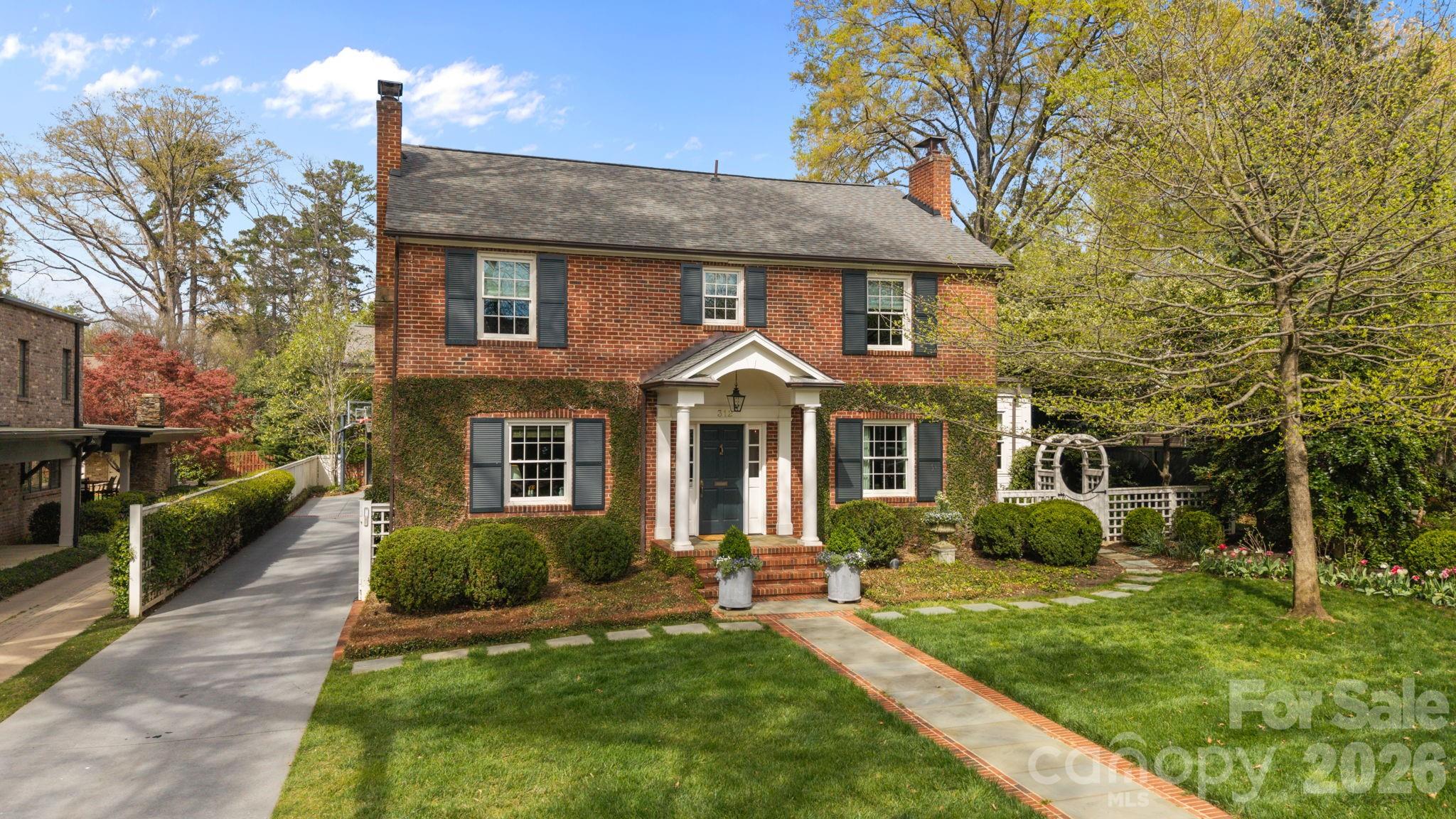 Timeless 5-bedroom, 4-bath home in highly sought-after Myers Park! Thoughtfully designed interiors blend classic charm with modern updates throughout. The updated kitchen opens seamlessly to a breakfast room & spacious family room overlooking the expansive & beautifully landscaped lot with an incredible covered porch, perfect for both everyday living & entertaining. The main level also includes formal dining, office, drop-zone and a private guest suite with en-suite bath. Upstairs, the primary suite offers a fabulous walk-in closet and a spacious, well-appointed bath, along with three additional bedrooms and two full baths. A detached garage with a fully renovated second living quarters above—complete with bedroom, full bath, and separate living area—provides exceptional flexibility for guests, office space, or exercise room. Located in the heart of Myers Park, walking distance to Freedom Park, the Greenway & Selwyn Ave - this is a truly special property!