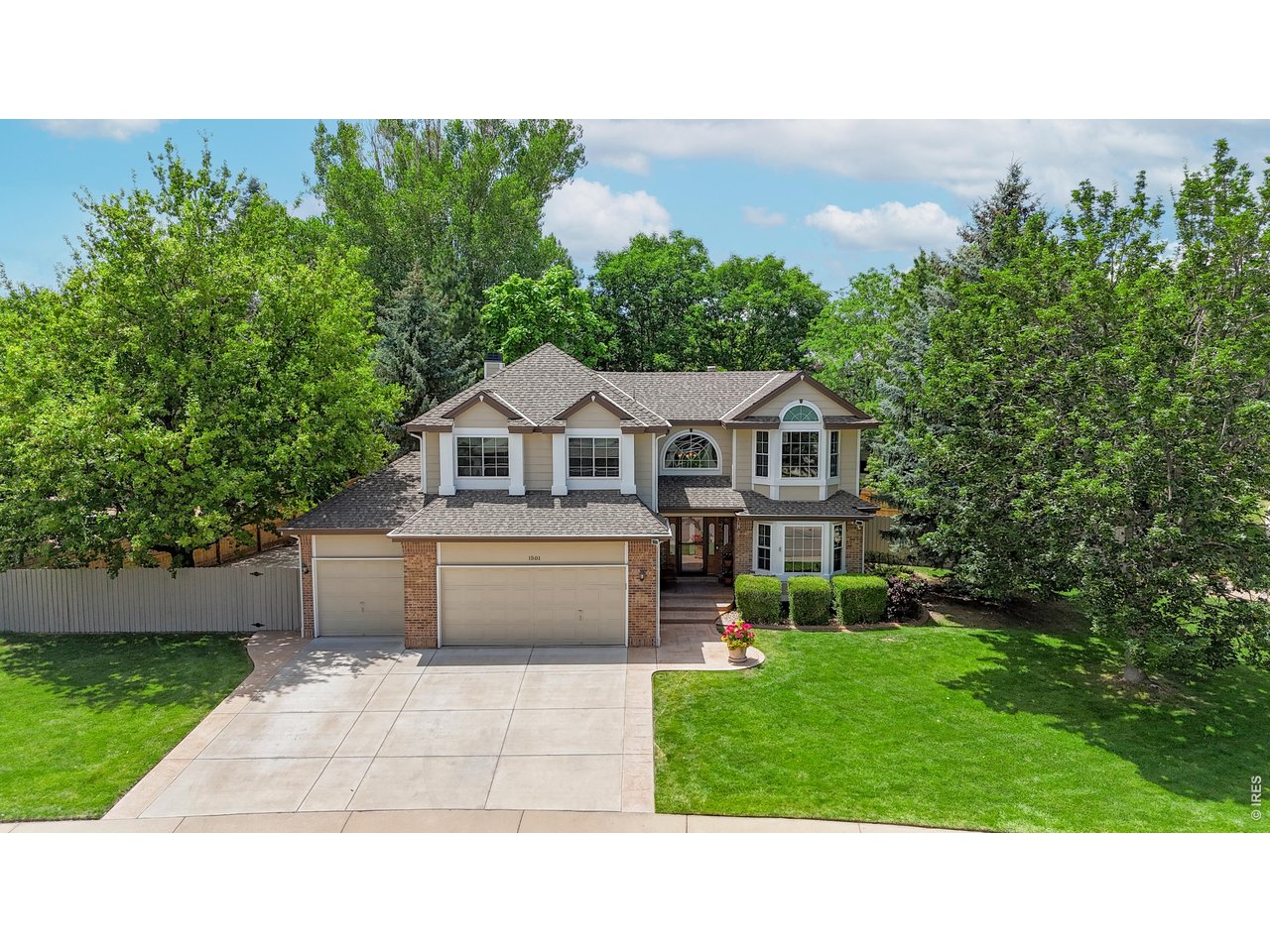 Welcome to this beautifully maintained 4-bedroom, 4-bath home tucked away on a quiet cul-de-sac in the Rock Creek community. This home has one of the best outdoor backyard in the whole neighborhood. Thoughtfully updated and lovingly cared for with a perfect blend of timeless style, everyday comfort and exceptional outdoor living. The first level has an inviting open floor plan with vaulted ceilings, rich hardwood floors and a dedicated home office. The heart of the home is the family room where a custom gas fireplace, stacked stone surround and historic hand-hewn mantel create a warm & welcoming space. The Outdoor Living Space is amazing! Custom designed by Environmental Designs, this is a backyard retreat. The waterfall is the center-piece of this oasis but the outdoor kitchen, natural gas fire pit, hot tub, mature trees and vibrant gardens make this space feel like a private getaway. Whether you're soaking in the hot tub after a long day or star gazing at night, you'll find that this peaceful setting extends the home's living space well beyond its walls. The spacious kitchen is both beautiful and functional with maple cabinetry, a sophisticated Blomberg stainless steel appliance suite and a generous walk-in pantry. Host a holiday celebration in the formal dining room this year. Upstairs, the primary suite offers a relaxing escape with a luxurious soaking tub, dual vanities and an oversized walk-in closet. Down the hall, 3 additional bedrooms and another full bathroom provide plenty of room for family & guests. The finished lower-level flex space is ideal as a media room, home gym or even a 5th bedroom. A private 3/4 bath adds convenience to this versatile space. Every detail reflects the home's exceptional quality including high-efficiency windows and solid wood doors throughout, an oversized three-car garage with an epoxy-coated floor, and a basketball half-court for more recreational fun. This home is ready for you now, and designed to grow with you.