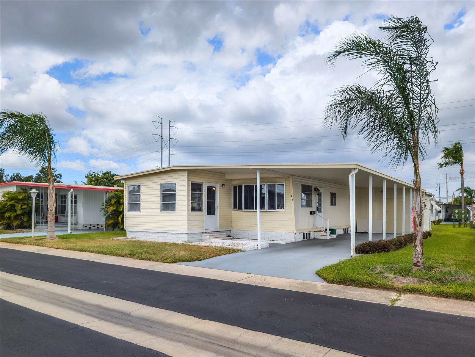This beautifully maintained 2-bedroom, 2-bath double-wide home is located in the highly sought-after Tarpon Shores 55+ community, OVER 20 K SPENT IN IMPROVEMENTS !!! Where you own the land! The $40K share price is included in the list price and can be financed through the HOA. OVER 20K IN UPGRADES RECENTLY DONE TO PREPARE THE HOME FOR SALE! BEAUTIFUL KITCHEN. NEW PLUMBING! NEW FLOORS! HOME HAS CLEAN 4 POINT. *NO FLOOD OR WIND DAMAGE! * Enjoy a spacious 2-car carport with a long driveway that can accommodate up to 2vehicles. Lovely Washer and Dryer included . Roof over in tip top shape!  Experience true worry-free living with low maintenance fees that cover a comprehensive list of services: water, sewer, cable, internet, common grounds, yard & pool maintenance. Plus, benefit from the convenience of a full-time Office Manager and Property Manager on-site, dedicated to the community's smooth operation. Embrace the Tarpon Springs Lifestyle: Living in Tarpon Shores means embracing the rich culture and natural beauty of Tarpon Springs, a truly unique Gulf Coast city. Famous for its historic Sponge Docks, you can explore authentic Greek restaurants, charming boutiques, and witness sponge divers in action. Beyond the docks, Tarpon Springs offers: Pristine Beaches: A short drive to stunning Gulf beaches like Fred Howard Park Beach and Sunset Beach, perfect for swimming, sunbathing, and breathtaking sunsets. Outdoor Recreation: Enjoy boating, fishing, kayaking, and paddle boarding in the calm waters of the Gulf and its many bayous. The Pinellas Trail, a paved multi-use path, is also nearby for walking and biking enthusiasts. Cultural Attractions: Discover local art galleries, museums, and enjoy various festivals and events held throughout the year that celebrate the city's Greek heritage and vibrant community spirit.