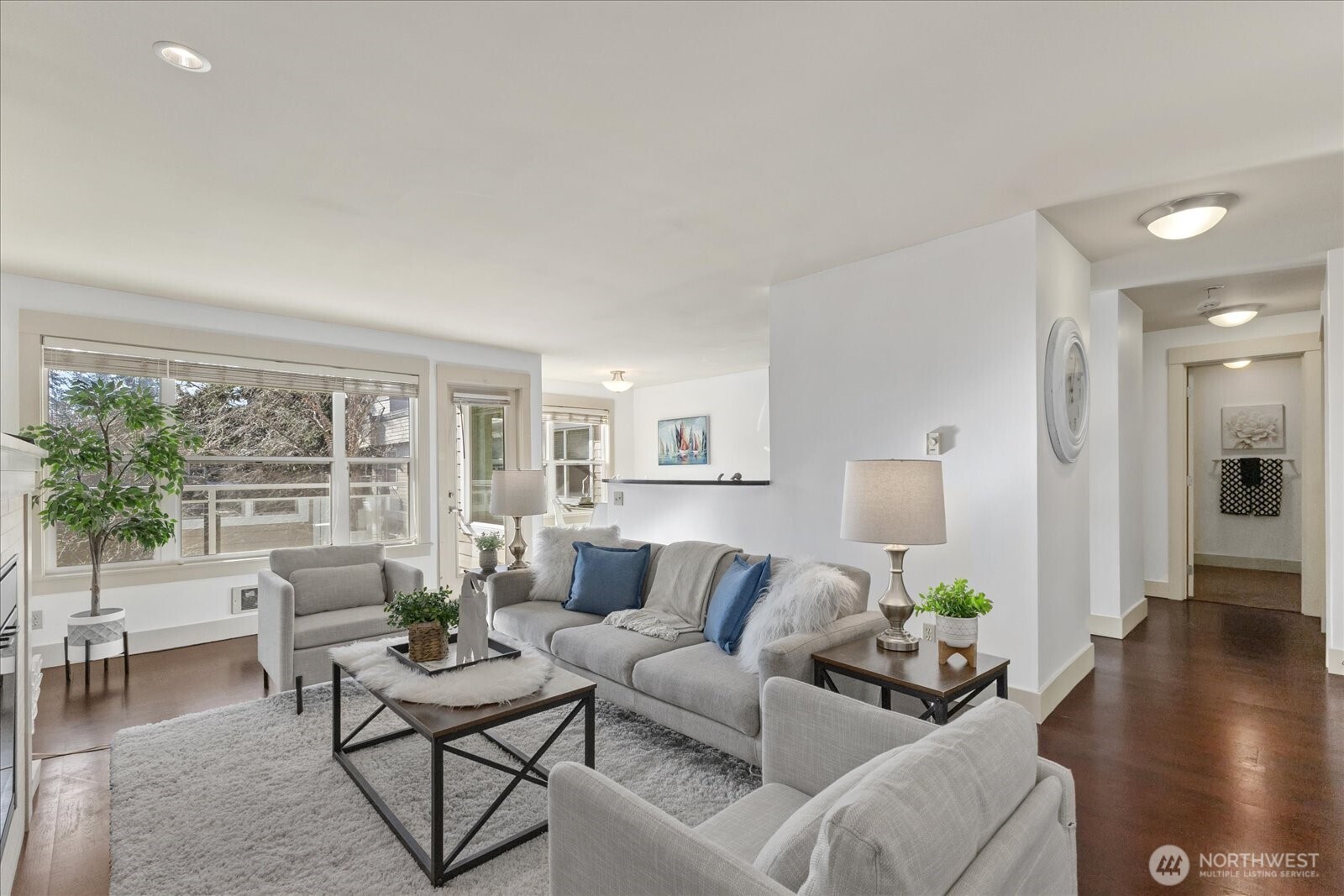 This top floor Edmonds condo offers the feel of a private retreat while keeping you close to everything. Filled with natural light, this bright and airy 1 bed, 1 bath home features hardwood floors, stainless steel appliances, granite countertops, a cozy fireplace, and a private balcony overlooking tranquil garden views. Enjoy everyday convenience with an in-unit washer and dryer, covered parking, extra storage, and an elevator in the building. Recent community upgrades include a new roof, new electrical panels, and refreshed common area carpet and paint. The park like grounds are enhanced by peaceful water features, creating a serene atmosphere throughout the property.  Resort style amenities include a sparkling outdoor pool, fully equipped fitness room, and clubhouse. With no rental cap, this home offers both flexibility and long-term value. Ideally located near I 5, Hwy 99, and just minutes from Downtown Edmonds shops, restaurants, and the waterfront. A rare blend of privacy, comfort, and convenience.