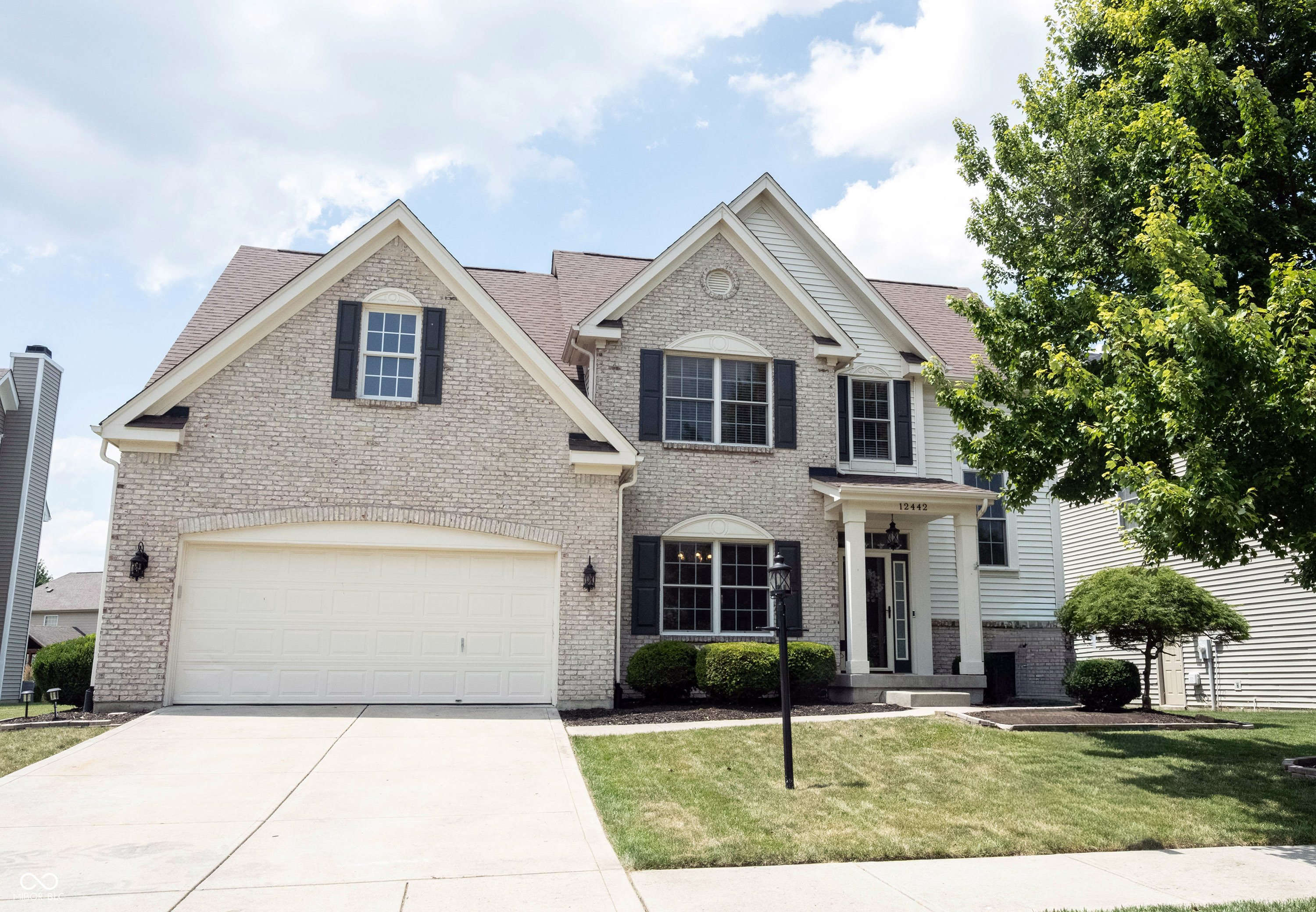 Welcome home to 12442 Goodloe Drive! Thoughtful updates, spacious living, and an unbeatable Fishers location come together to make this home perfect. Nestled in the lovely neighborhood of Oak Hall just minutes from shopping, dining, parks, and everyday conveniences, this well-maintained two-story home offers over 3,100 square feet of comfortable living space designed for both everyday life and entertaining.  Step inside to find soaring vaulted ceilings, luxury vinyl plank floors, and finishes that make this home truly move-in ready. The functional floor plan features four generously sized bedrooms, two full bathrooms, and a convenient half bath, offering flexibility for families, guests, or a home office.  The finished basement provides valuable additional living space-perfect for a recreation room, media room, fitness area, or playroom. Outside, unwind on the screened-in porch overlooking the large backyard, creating the ideal spot to enjoy your morning coffee or watch the sunset.  Located in one of Fishers' most sought-after areas, this home offers the perfect combination of space, comfort, and convenience. Don't miss your opportunity to make 12442 Goodloe Dr your new home!