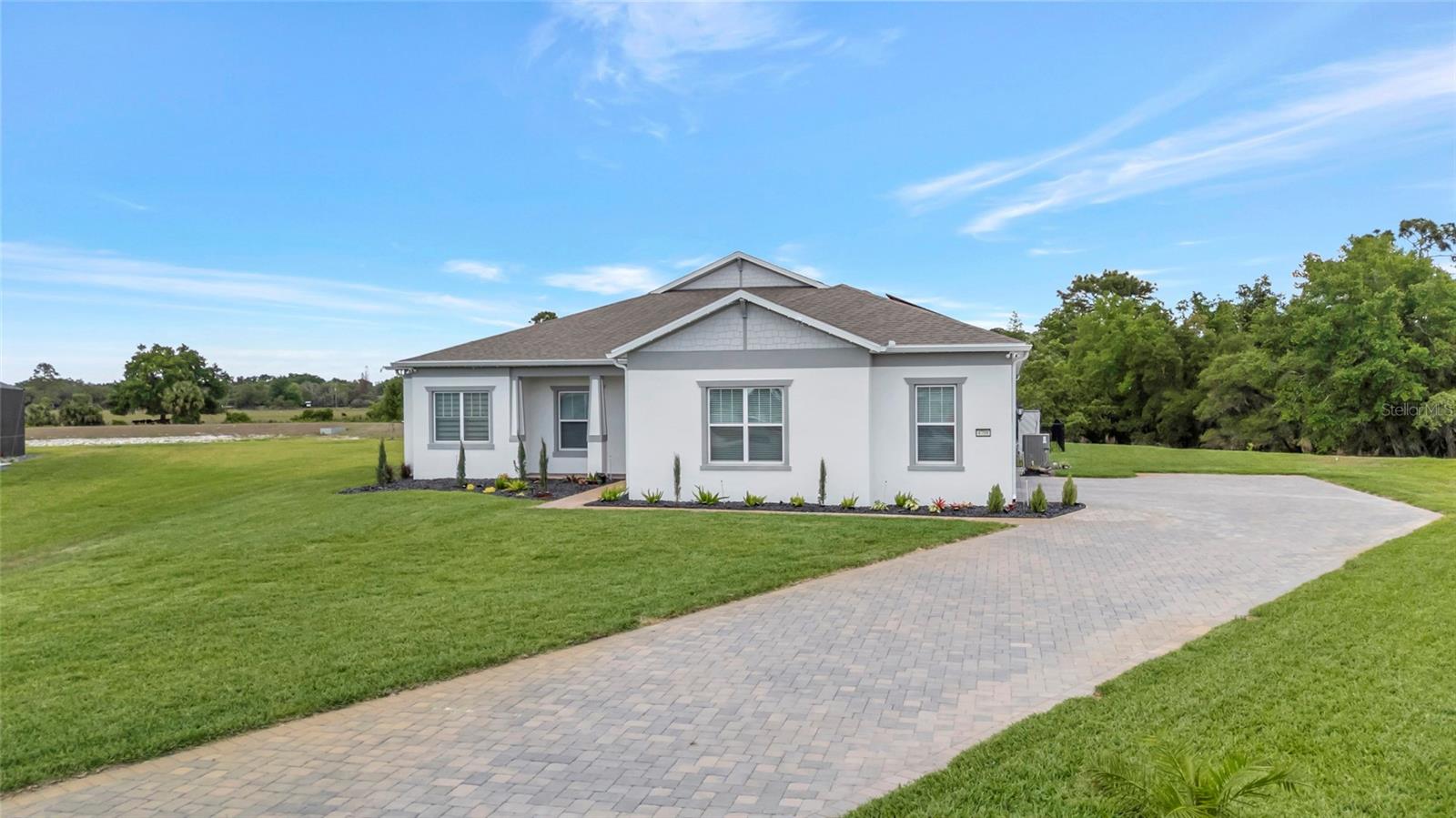 Welcome to 4708 FLAGSTAFF CT. Located in Sunset Preserve, this nearly new 2025 pool home sits on a premium cul-de-sac .61acre premium lot, a rare find in this area, delivering privacy, space, and flexibility most buyers can’t get in new construction. With over 3,000 sq ft, this home features 4 bedrooms, 3 full baths, and a dedicated office, ideal for remote work or flex space. The open-concept layout is built for real living, with seamless flow, clean sightlines, and abundant natural light, all anchored by ceramic tile flooring throughout for a clean, low-maintenance finish.The kitchen is a true centerpiece, featuring quartz countertops, custom cabinetry with glass upper cabinets, backsplash, built-in oven and microwave, cooktop, wine cooler, high-end stainless appliances, custom island pendant lighting, and a fully customized pantry with built-in shelving. The dining room is elevated with a custom chandelier, while the living room impresses with a coffered ceiling, surround sound, custom ceiling fan, and a three-pane sliding glass door opening directly to the pool.High-end finishes carry throughout the home, including crown molding, tall baseboards, and custom lighting that elevate the overall feel well beyond builder grade.The primary suite is privately positioned with French door entry and a tray ceiling, while the home’s entry makes a strong first impression with dual tray ceilings.Step outside to a fully finished private pool with paver deck, sun shelf, and water features, all enclosed with frameless screen panels designed to maximize unobstructed views. The backyard is one of the standout features, backing directly to conservation with no rear neighbors and beautiful views toward the lake, delivering the privacy buyers are actively searching for. The space is already pre-plumbed and pre-wired for an outdoor kitchen, and the lot offers true usable land for expanded outdoor living.Additional highlights include an oversized, expanded 3-car side-entry garage with EV charging, HVAC system with built-in UV air purification, pre-plumbing for a water softener, and low HOA. The home has a private well used to irrigate the grounds.Homes like this, nearly an acre, private pool, cul-de-sac location, no rear neighbors, conservation and lake views, and a dedicated office—don’t come up often. Sunset Preserve is a gated estate community offering half-acre+ and lakefront homesites with private boat ramp access to Lake Pickett, plus a lakefront pavilion and playground. Located just minutes from 417 & 408, you get fast access across Orlando with shopping, dining, and entertainment nearby at Waterford Lakes Town Center, Waterford Towers, Oviedo Mall, and East Colonial Drive.