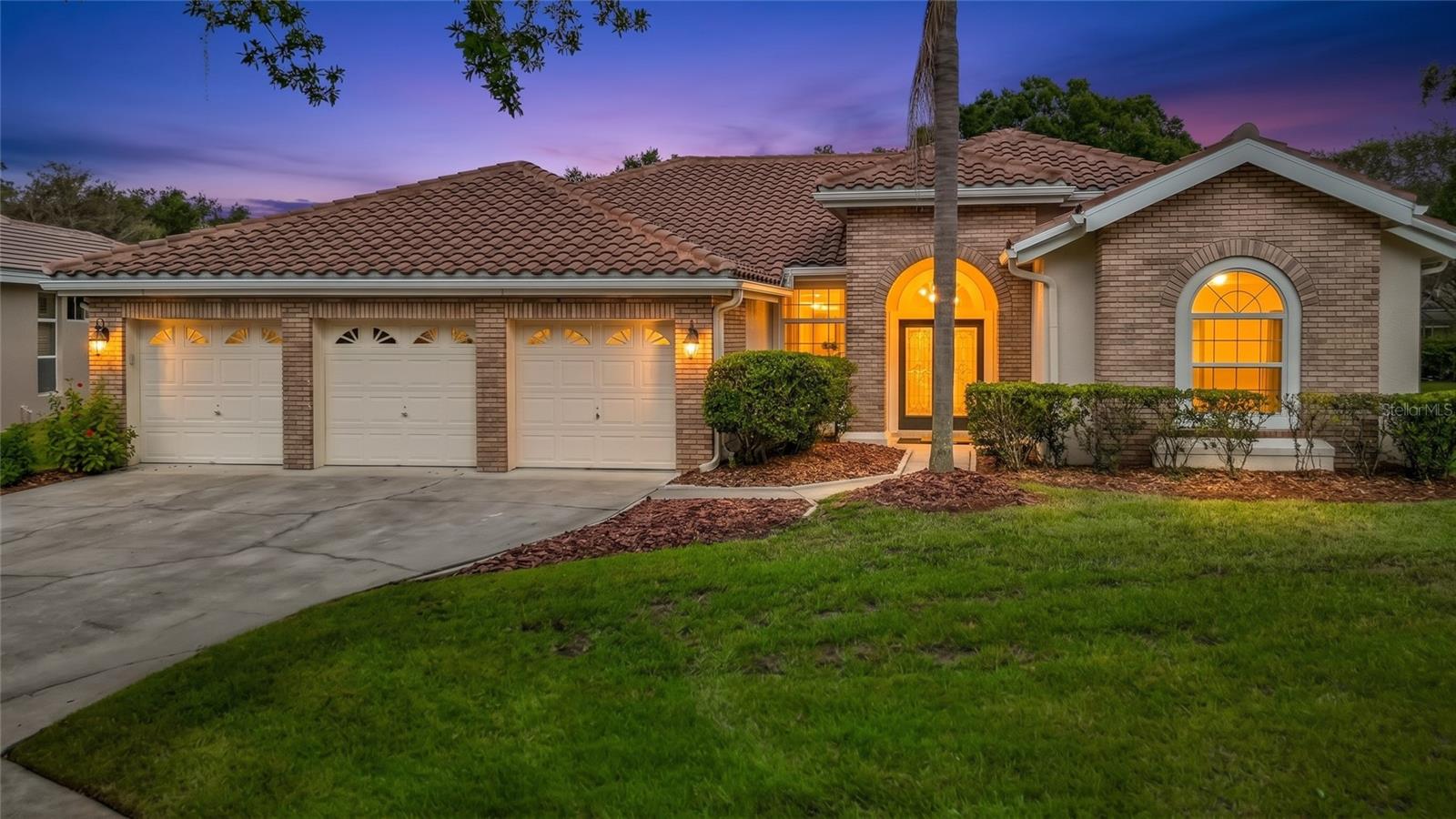 Beautiful updates, a refreshed pool retreat, and a desirable Hunter’s Green location come together at 8704 Broadgreen Ct! Situated on an oversized cul-de-sac with just three homes, this 4-bedroom, 3-bath home offers nearly 3,000 square feet of living space and an extensive list of improvements.Glass double entry doors with wrought-iron detailing create a striking welcome. Inside, water-resistant Pergo Max flooring installed in 2023 flows throughout the home, complemented by Sherwin-Williams interior paint, updated lighting and ceiling fans, and custom window shades. The kitchen was refreshed in 2023 with refaced cabinetry, granite countertops, a tile backsplash, and new stainless steel appliances, followed by an upgraded refrigerator in 2026.Enjoy Florida outdoor living on the lanai and around the beautifully refreshed pool. Resurfaced in 2025 with artistic pavers and updated coping, the pool area provides an inviting setting for relaxing or entertaining. A new pool pump and timer were also installed in 2025, while the pool bathroom was updated in 2022.Additional improvements include a tile roof with two layers of underlayment, seven-inch front and rear gutters, and exterior paint in 2021; replacement vinyl double-pane windows on the west side of the home; and a new water heater in 2025. The home is also wired for a generator to serve the kitchen, office, and primary bedroom; generator not included.Enjoy access to the surrounding area’s recreation and entertainment, including nearby Flatwoods Park’s miles of biking and hiking trails and the New Tampa Performing Arts Center. Hunter’s Green offers community events and beautifully landscaped surroundings, with golf, tennis, swimming, pickleball, and dining available through Hunter’s Green Country Club, subject to membership and fees. Convenient access to Tampa, Wesley Chapel, USF, Moffitt Cancer Center, and Busch Gardens adds to the appeal.Lanai and pool furniture, along with the billiards table, are negotiable. Schedule your private showing and experience this beautifully updated Hunter’s Green home!