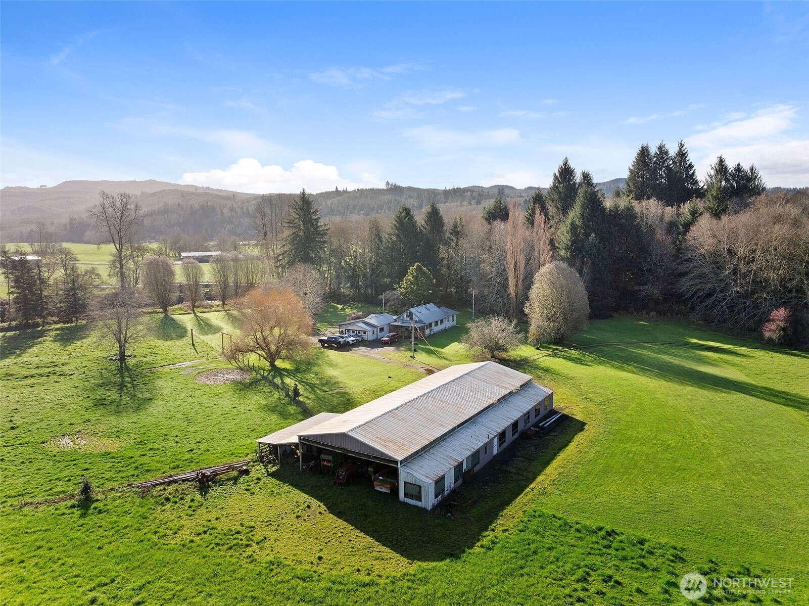 This exceptional property offers nearly 7,000 feet of river frontage, 1000ft turf air strip, airplane hanger, and 3 hole golf chipping range creating a private and serene setting with endless opportunities for recreation, relaxation, and scenic views in every direction. This home has thoughtful modern updates including fiberoptic internet, yet retains its original charm while incorporating modern comforts, making it both inviting and practical for everyday living or a peaceful retreat. Large windows capture the surrounding landscape, bringing in natural light and showcasing the expansive grounds. Equestrian and agricultural enthusiasts will appreciate the well-equipped infrastructure, including a massive 60x100 barn complete with stalls, ideal for livestock or horses. The majority of the acreage is fenced and ready for pasture use, offering flexibility for a variety of operations. A truly unique feature of this property is the private 1,000-foot airstrip with taxiway, along with a small airplane hangar perfect for aviation enthusiasts or those seeking ultimate accessibility and convenience. Whether you envision a working farm, equestrian estate, private getaway, or legacy property, this one-of-a-kind offering delivers unmatched versatility, privacy, and opportunity in a stunning riverfront setting.