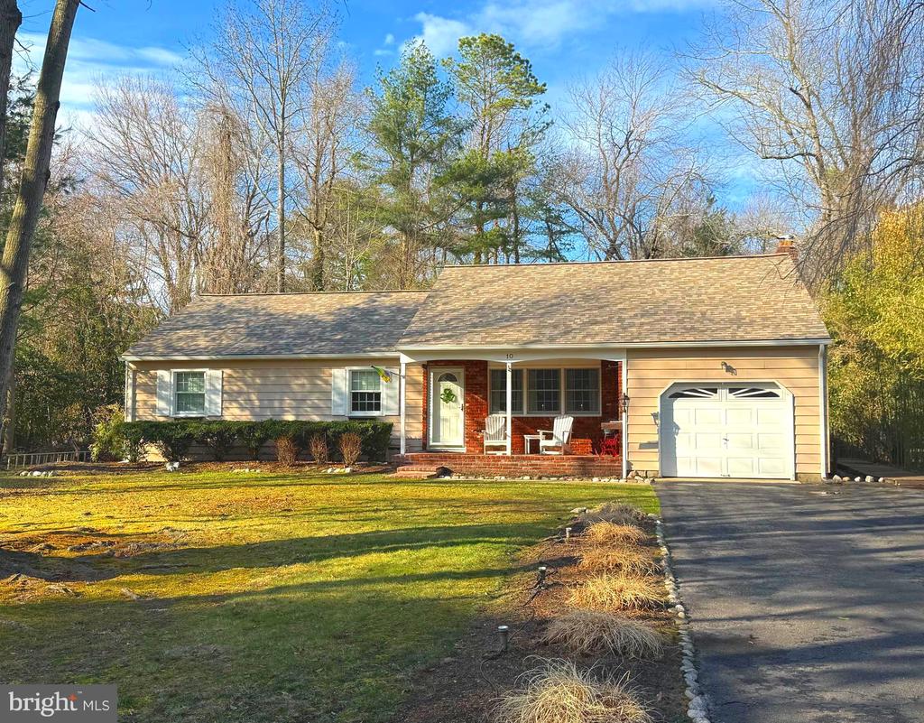 Professional Photos Coming Soon!!  Welcome to 10 Normandy Drive in the highly desirable Sherwood Forest community! This beautifully maintained ranch home offers comfortable one-floor living and a fantastic location within one of the area’s most beloved neighborhoods.  Step inside to find three spacious bedrooms and 1.5 bathrooms, along with a warm and inviting layout perfect for everyday living. The open-concept kitchen flows seamlessly into the family room, creating a bright and welcoming gathering space highlighted by a cozy fireplace. The kitchen features a generous peninsula, offering plenty of prep space and room for casual seating.  Just beyond the main living area, a sunroom addition provides the perfect spot to relax with your morning coffee, enjoy the changing seasons, or entertain guests. Outside, the deck overlooks the yard, ideal for outdoor dining or unwinding after a long day. A new roof adds additional peace of mind for the next owner.  Living in Sherwood Forest means enjoying an active community lifestyle with amenities that include a swimming and fishing lake, pavilion, tennis and basketball courts, playground, scenic hiking trails, and a variety of neighborhood events throughout the year.  Don’t miss this opportunity to own a lovingly cared-for home in a wonderful community!