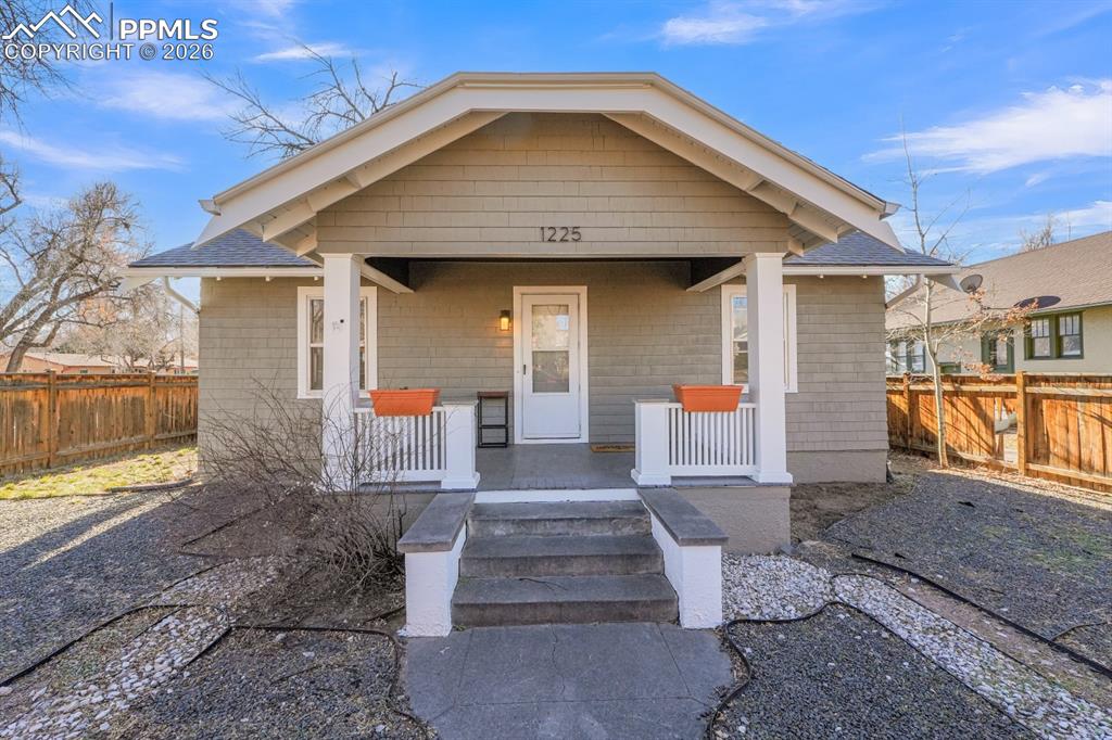 Welcome to a beautifully updated 1929 bungalow ideally located in the heart of downtown Colorado Springs. This charming home blends classic character with thoughtful modern updates, offering over 1,800 square feet of flexible living space.The main level features gorgeous hardwood floors, recessed lighting, and a bright living room that flows seamlessly into the dining area. The updated kitchen is a standout with granite/quartz countertops, tile flooring and backsplash, all-new cabinetry with glass knobs, new light fixtures, and a full appliance package including gas/electric cooktop, oven, microwave, refrigerator, and dishwasher. Two bedrooms and a beautifully updated full bathroom complete the main level, along with a convenient laundry room on the enclosed back porch.The fully finished basement expands the living options with LVP flooring throughout, a large family room with great natural light, two bedrooms with large egress vinyl windows, and a stylish three-quarter bathroom featuring a double vanity. Ideal for multi-generational living, long-term main-level living with basement flexibility, or potential short-term rental use (buyer to verify).Situated on a corner lot with off-street parking, this property also offers fully fenced front and back yards, a concrete patio, and a large storage shed. Additional upgrades include all new interior and exterior paint (2025), radon mitigation system, newer electrical panel, and a 2016 furnace.A rare combination of charm, updates, and versatility in an unbeatable downtown location. Schedule your showing today!